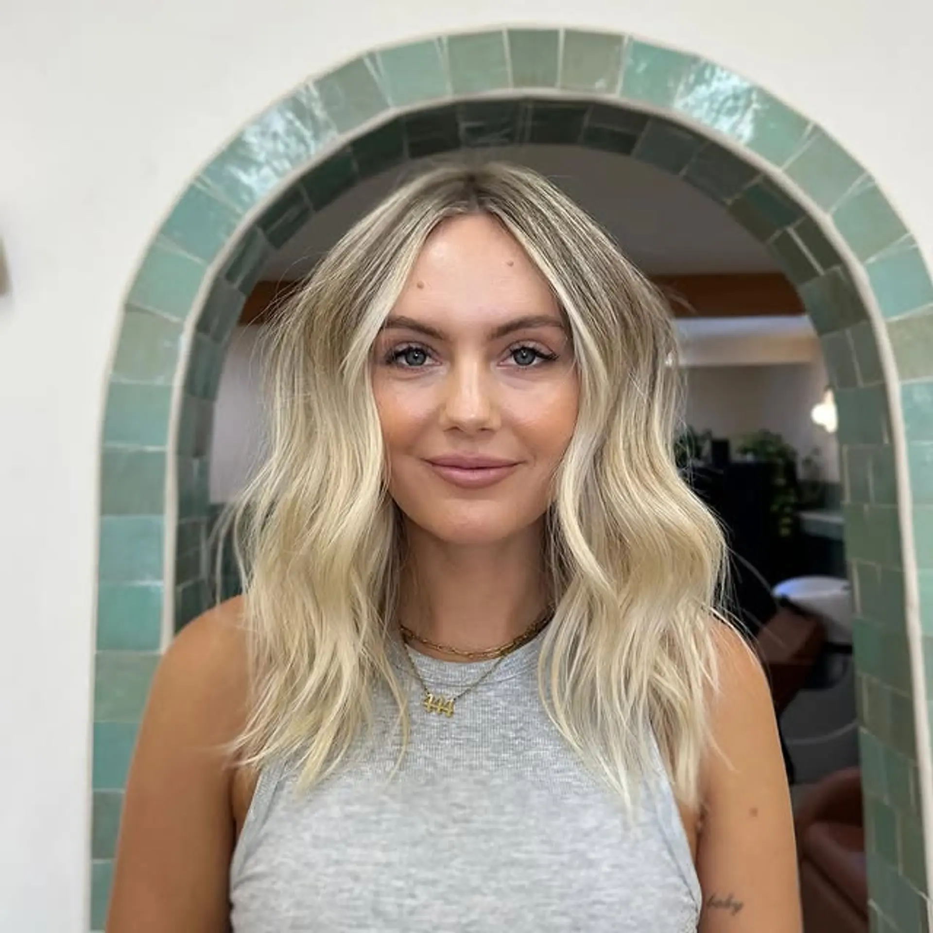 A wavy lob with beachy blonde balayage highlights. 1