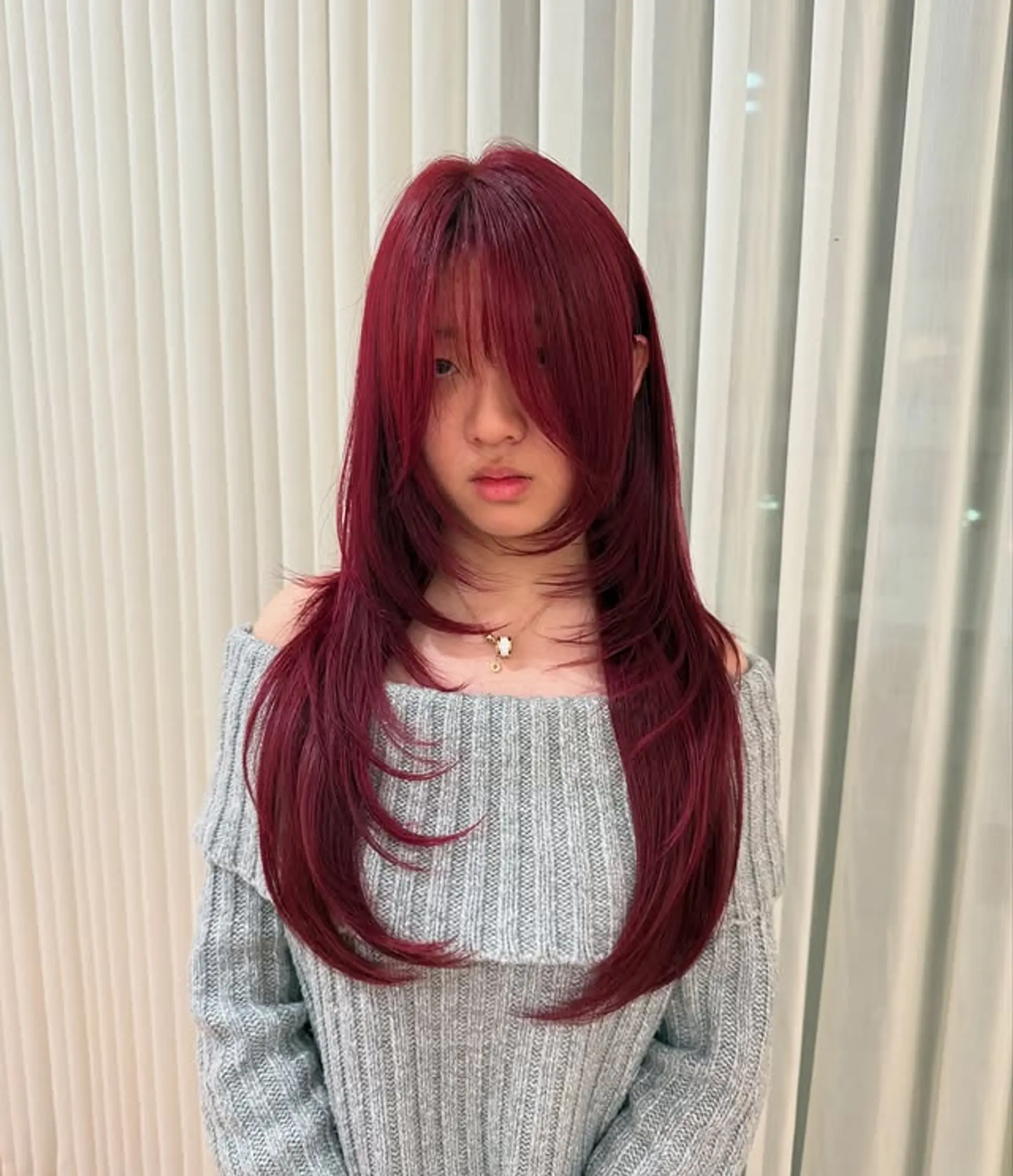 A shag haircut with curtain bangs and face-framing layers. 1