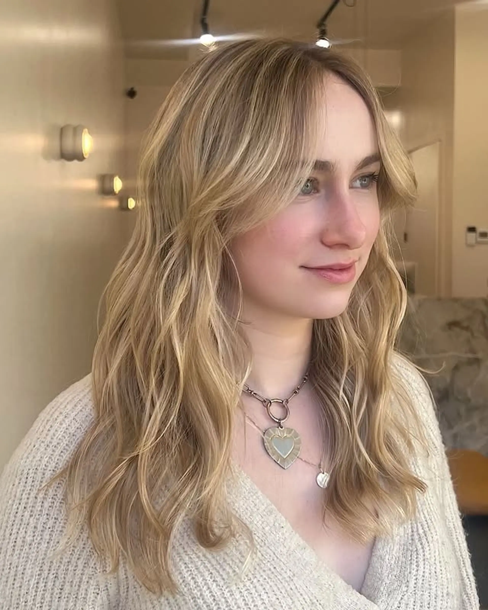 A trendy shaggy hairstyle with lots of layers and flattering curtain bangs. 1