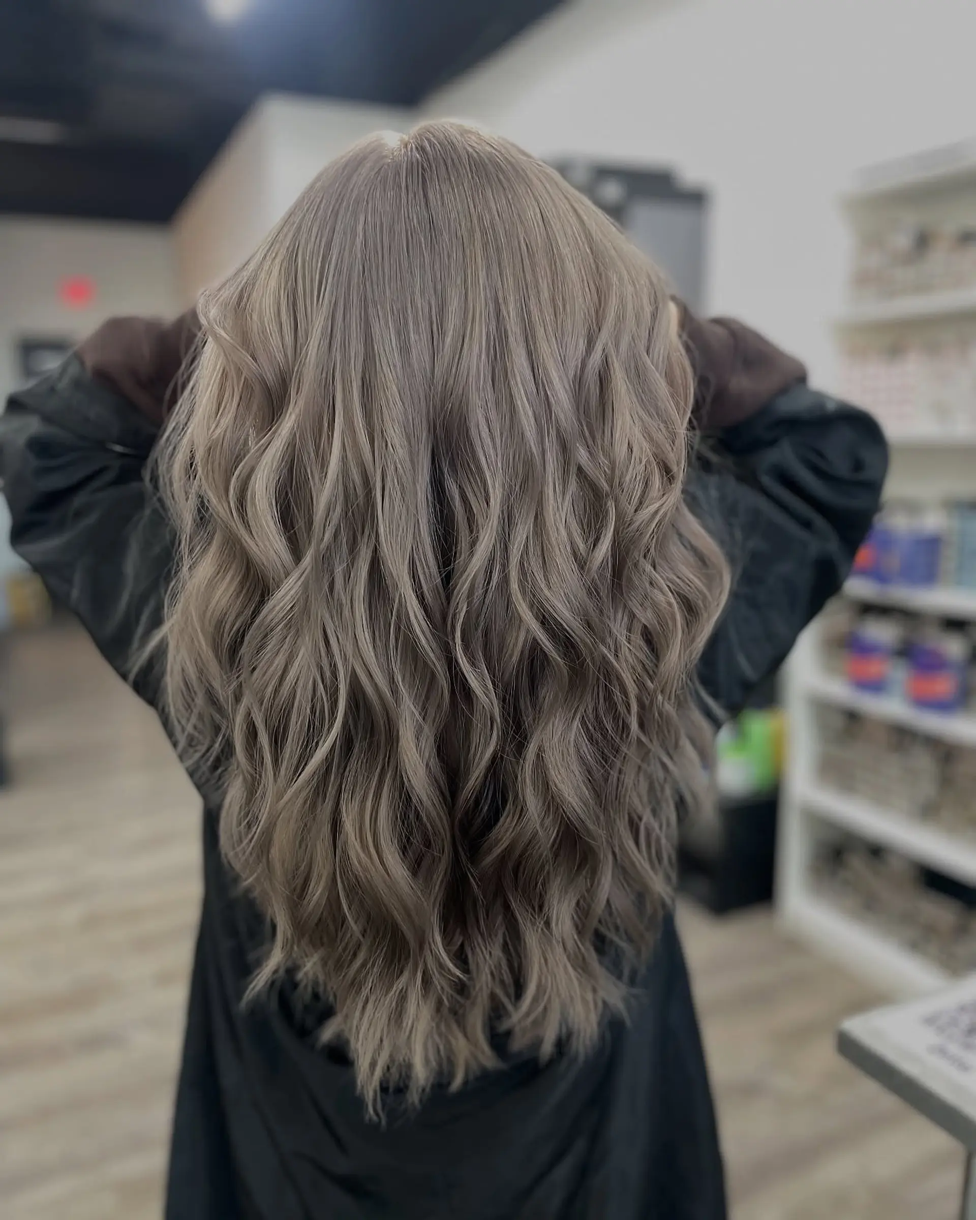 Long, flowing beach waves with a modern ash blonde color. 1