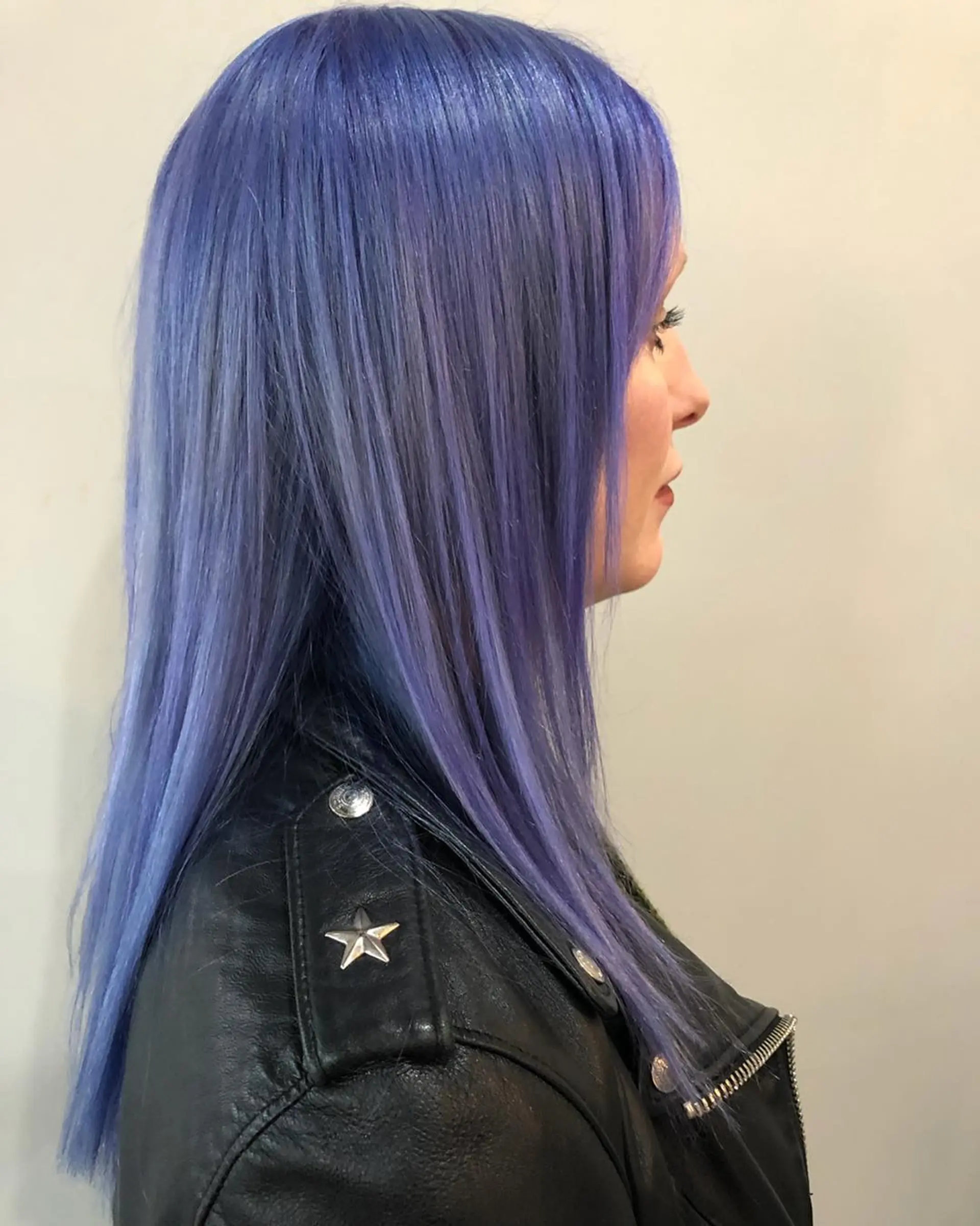 Long, sleek straight hair colored in a soft pastel periwinkle tone. 1