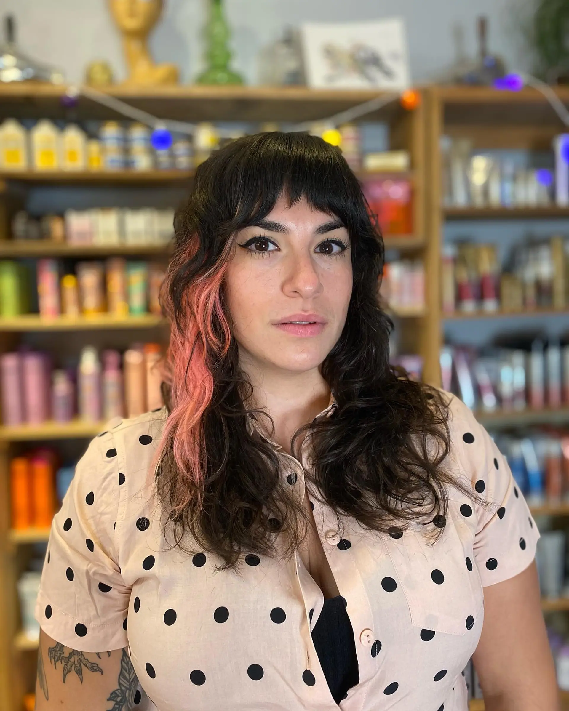 A choppy, medium-length shag with face-framing bangs and vibrant pink highlights. 1