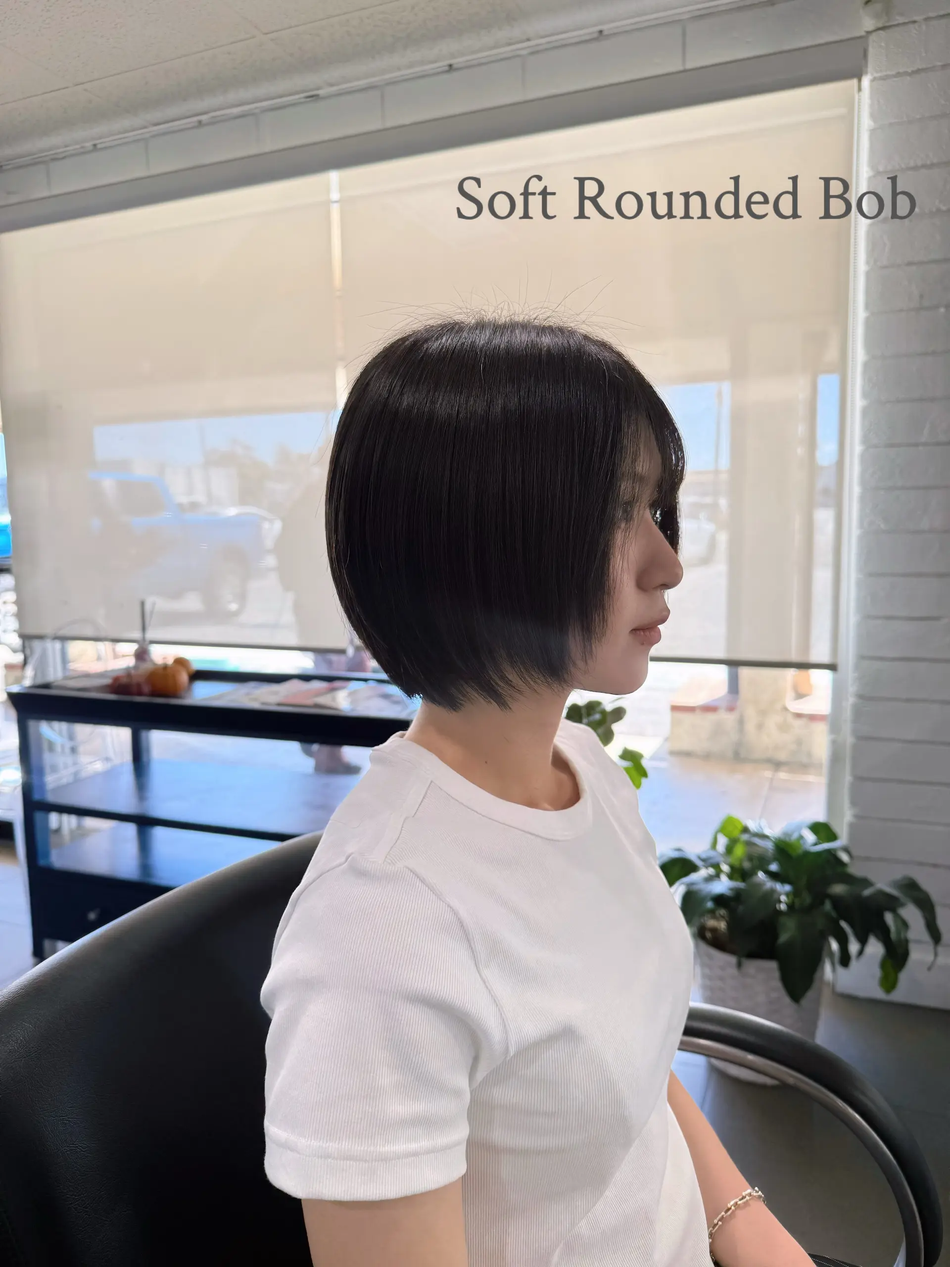 A sleek, soft rounded bob featuring subtle face-framing layers and a contoured silhouette. 1
