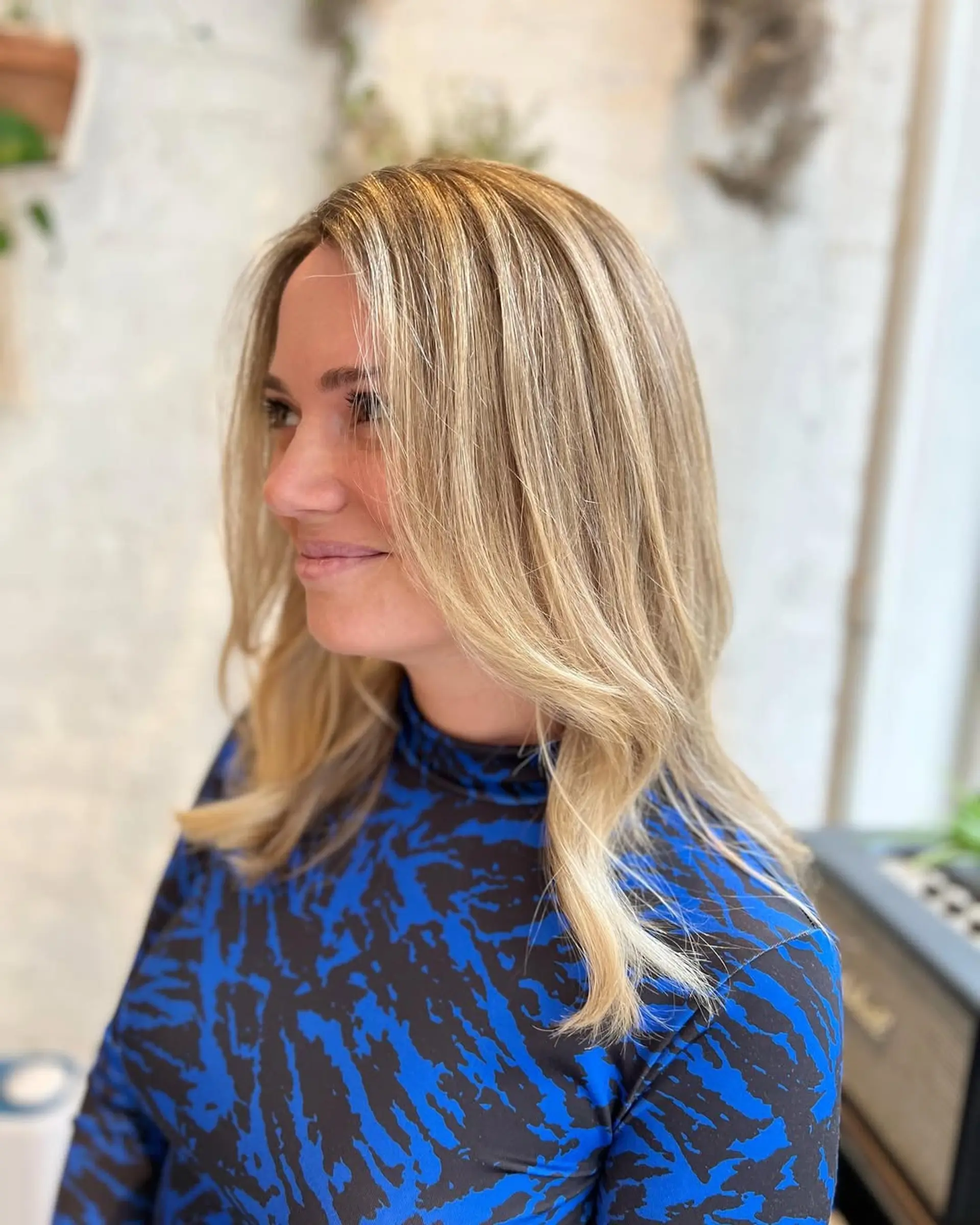 A beachy blonde balayage lob with soft waves. 1