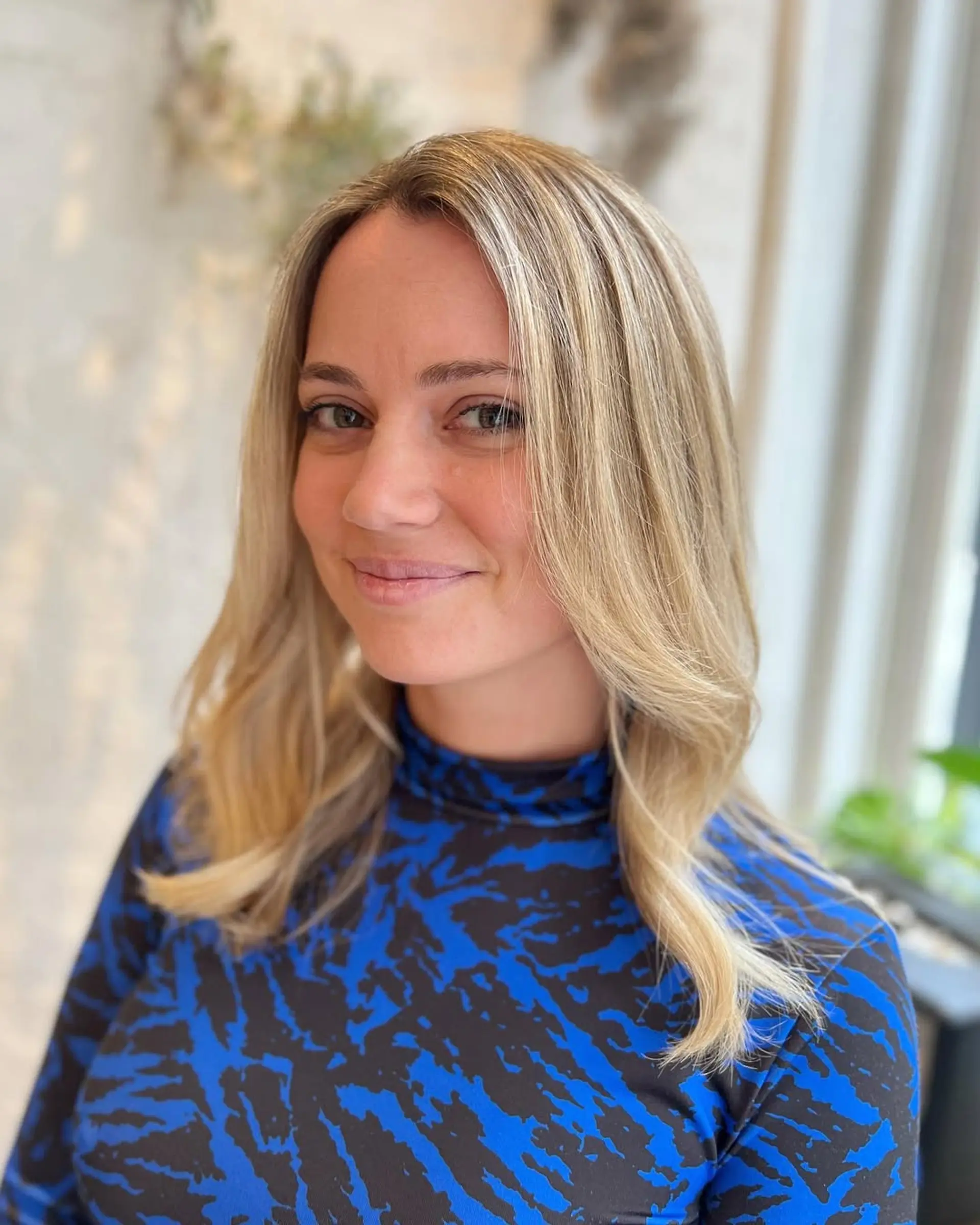 A beachy blonde balayage lob with soft waves. 2