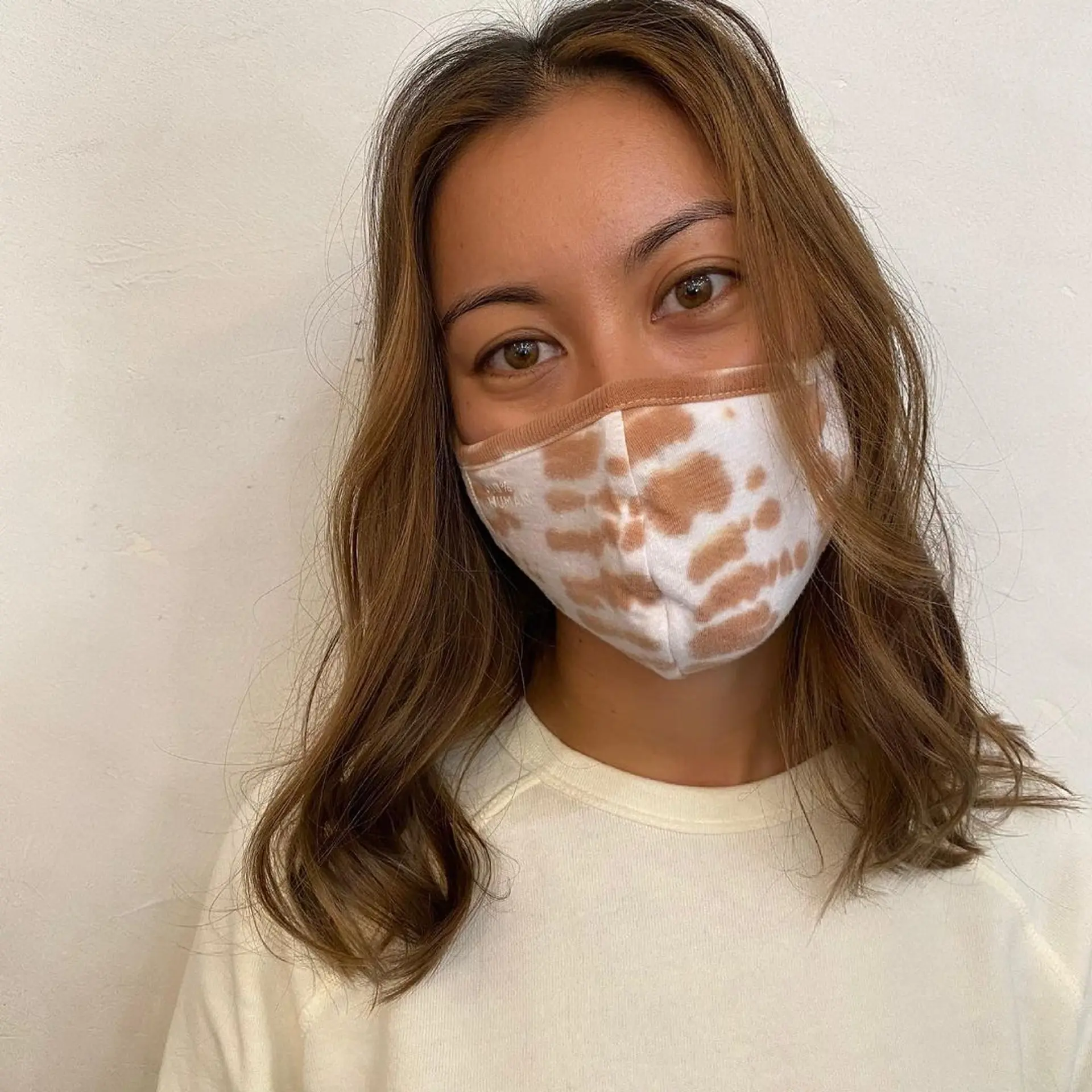 Medium-length wavy brown hair with honey highlights, parted in the center. The waves are soft and natural, with minimal layers for a relaxed, effortless look. (Hair by Coco) 1