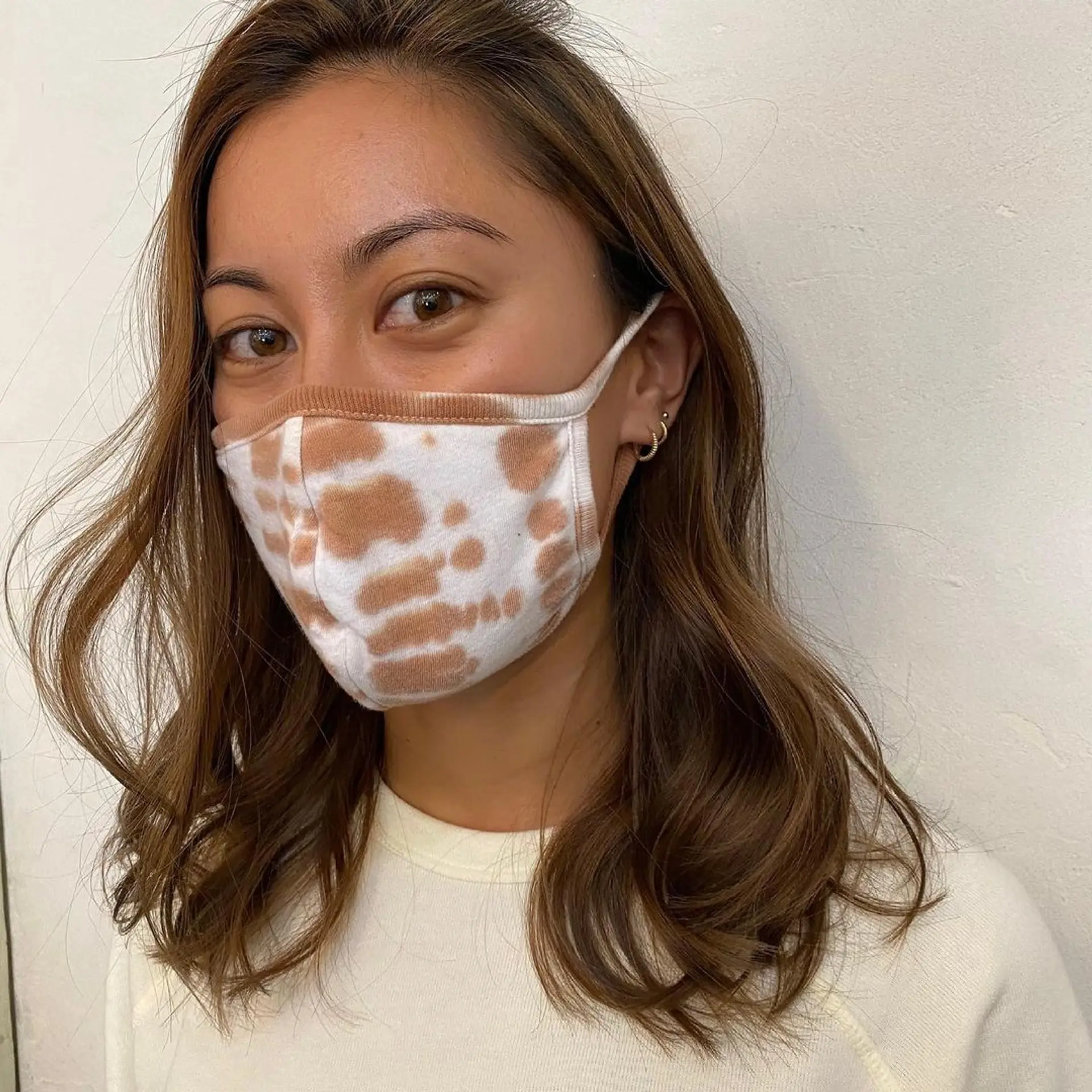 Medium-length wavy brown hair with honey highlights, parted in the center. The waves are soft and natural, with minimal layers for a relaxed, effortless look. (Hair by Coco) 2