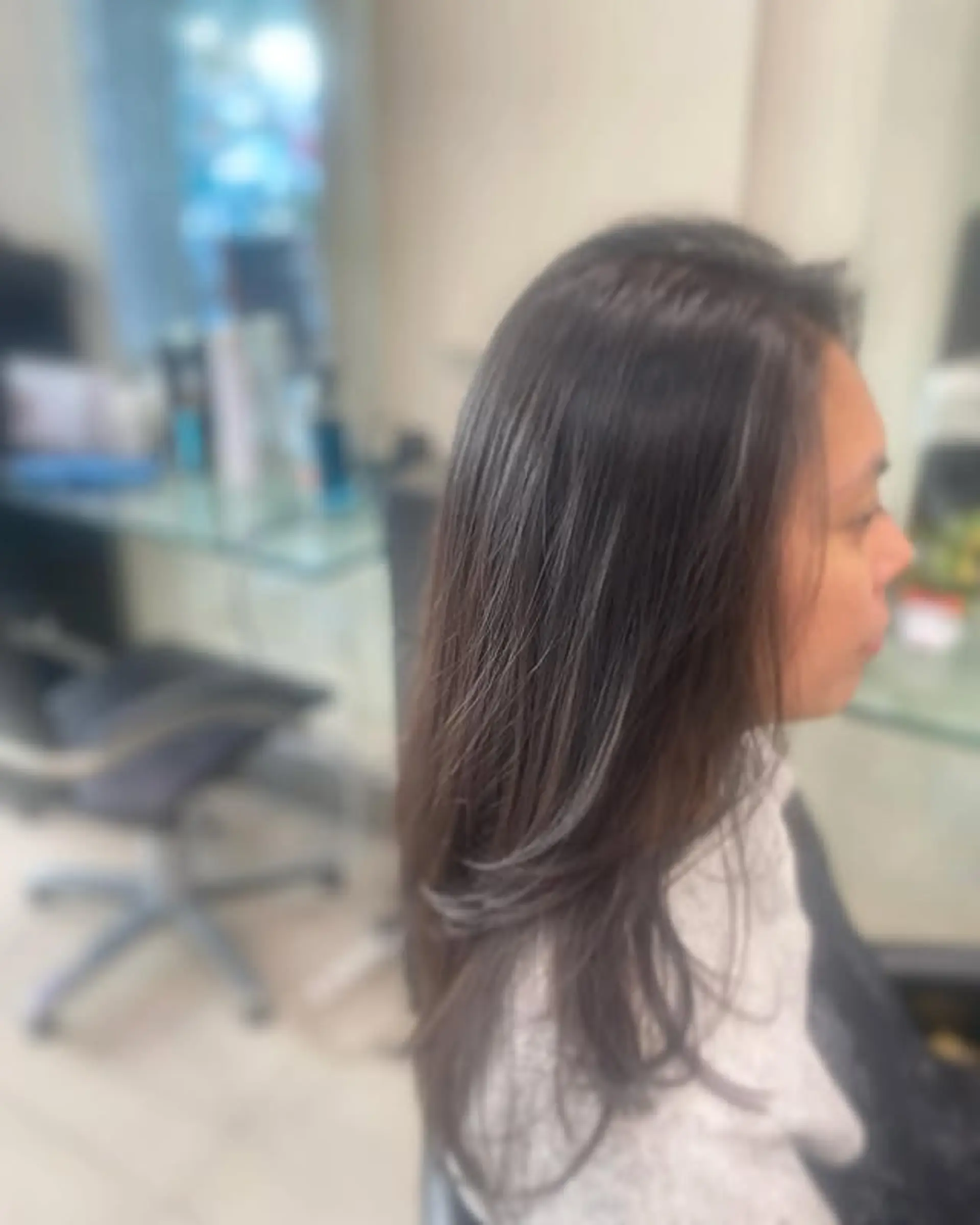 A medium-length, layered cut with silver highlights. 1