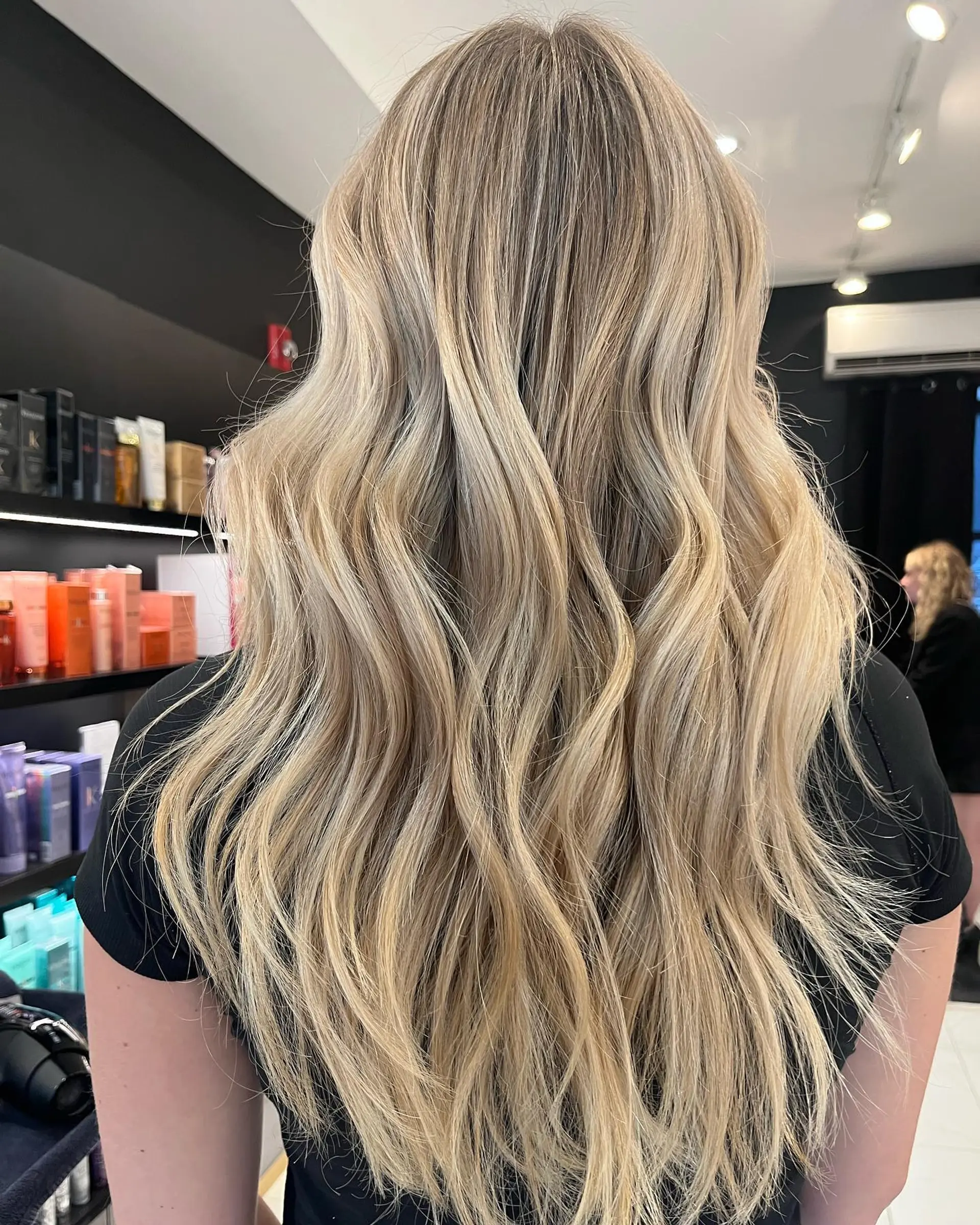 Long, wavy hair with a blonde balayage. 1