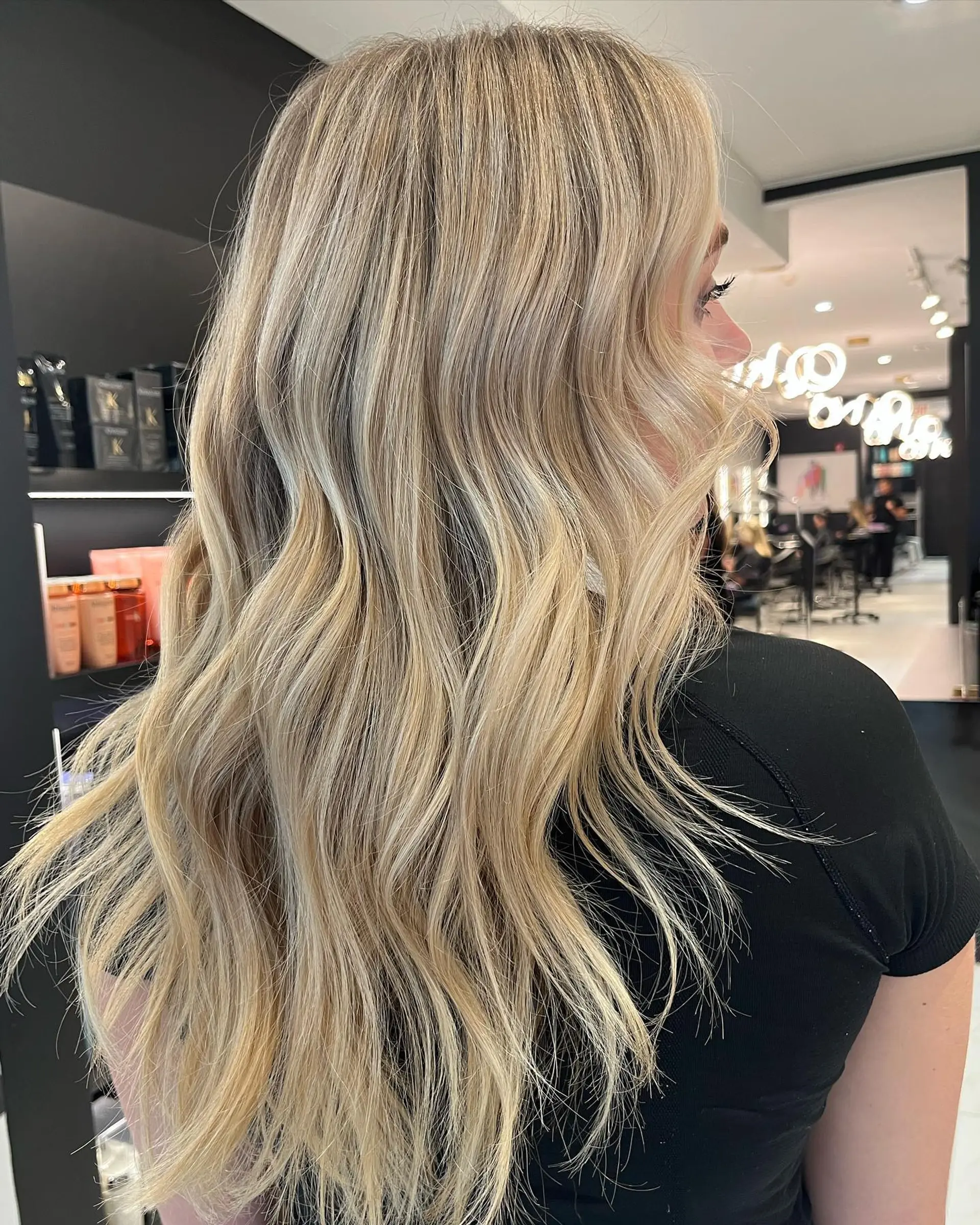 Long, wavy hair with a blonde balayage. 3