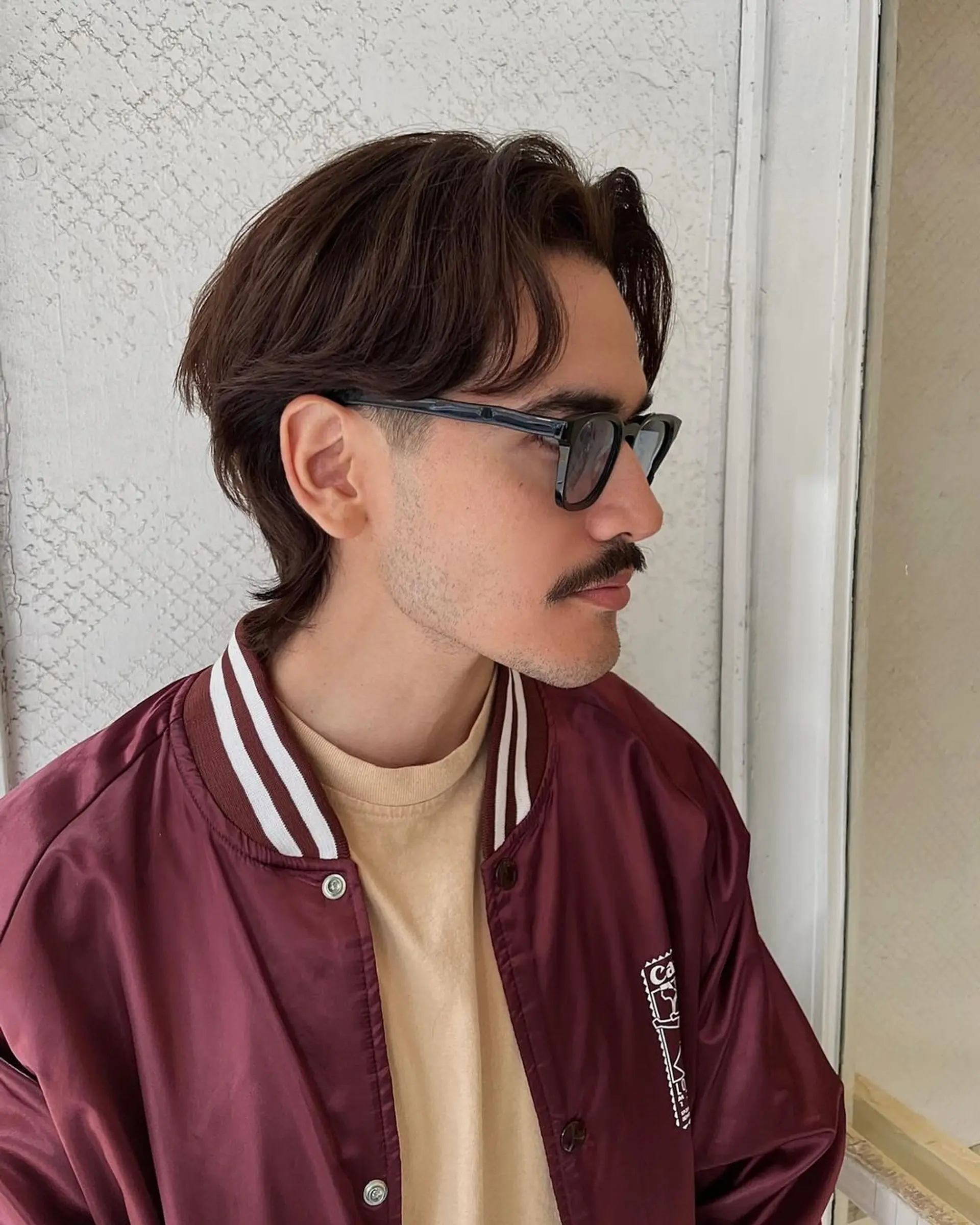 Medium-length, wavy brown hair with a side-swept fringe and layered for volume. 1