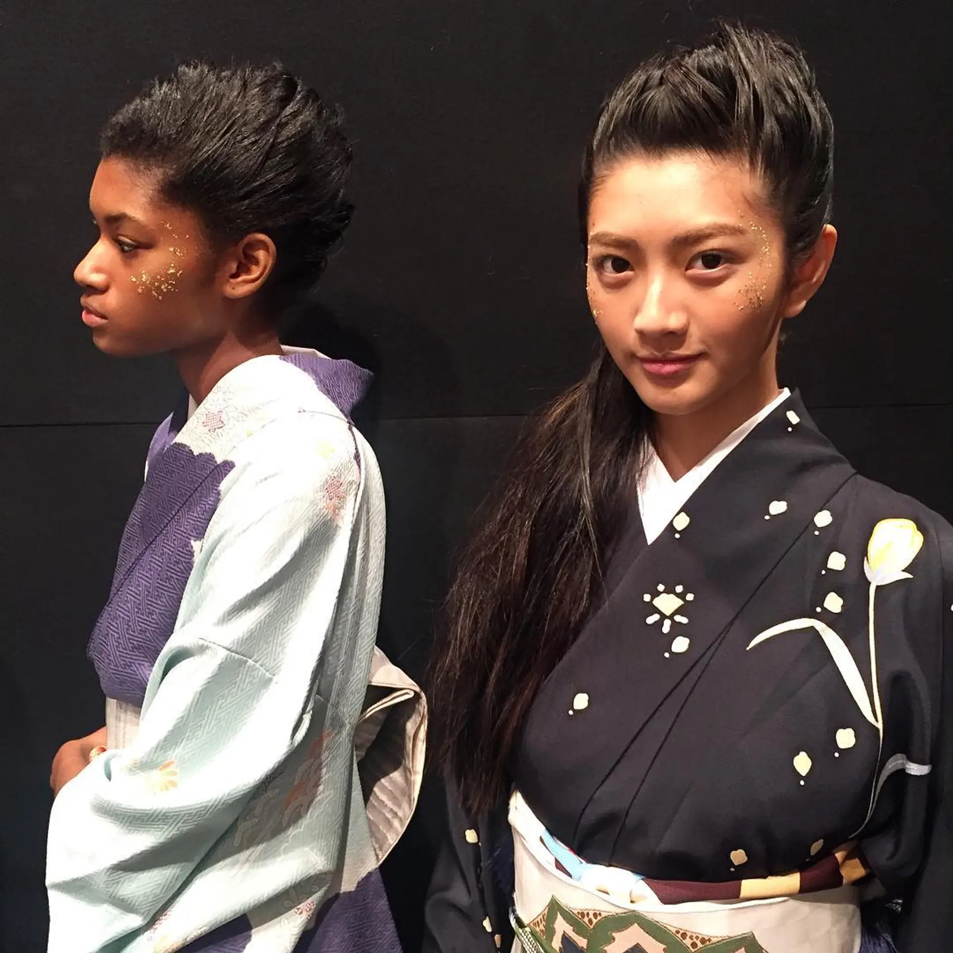 Intricate updo with sleek, straightened hair pulled back combined with a voluminous top crown, cascading into free-flowing waves. Styling done by the Room hair team for the NYFW, Hiromiasai show.  1