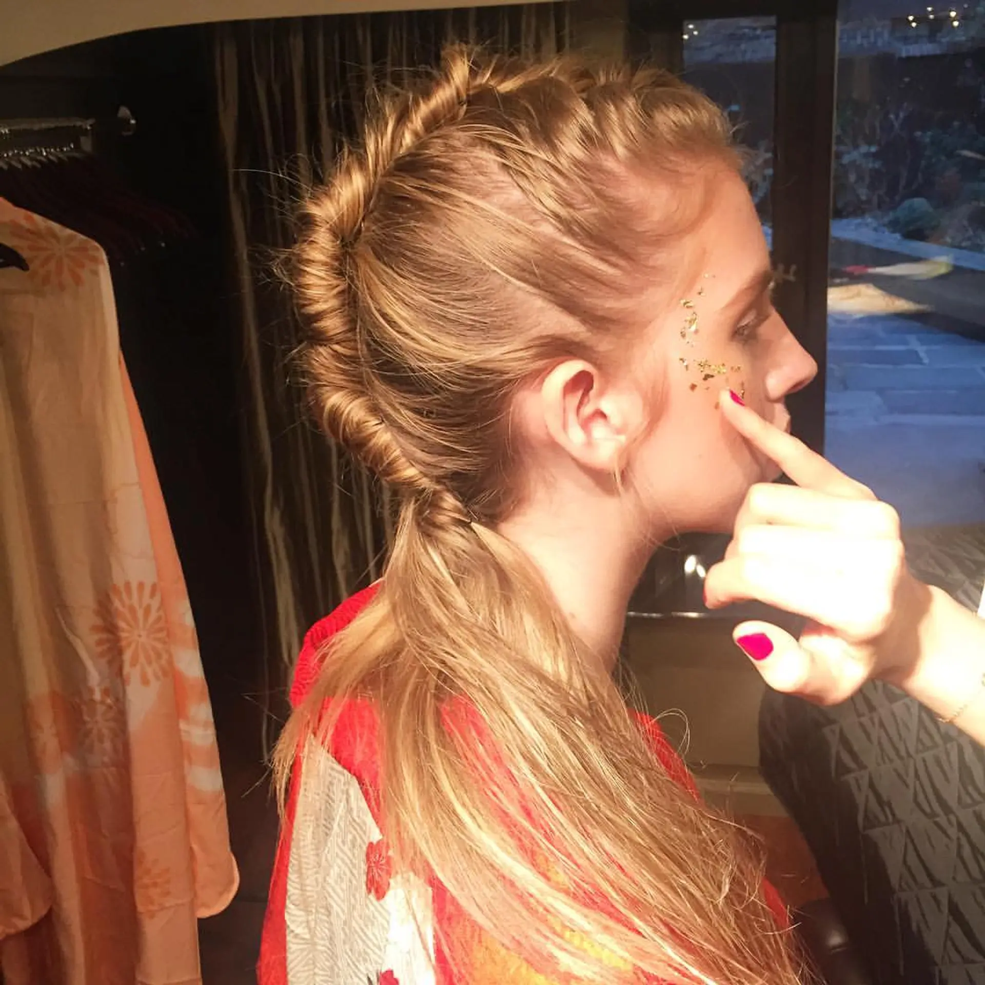 Intricate updo with sleek, straightened hair pulled back combined with a voluminous top crown, cascading into free-flowing waves. Styling done by the Room hair team for the NYFW, Hiromiasai show.  2