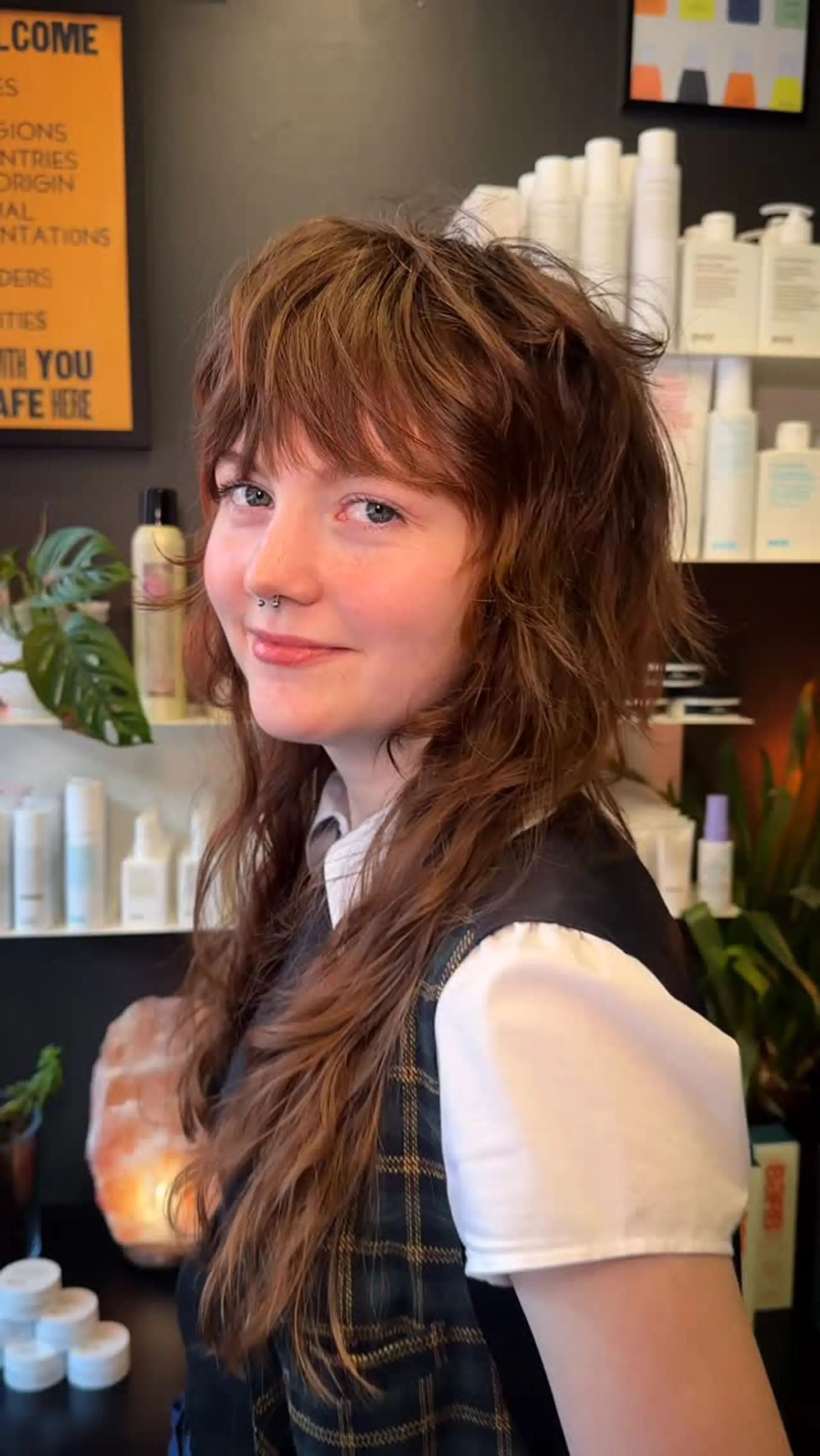 A soft lived-in shag haircut with choppy, textured layers and a full brow-skimming fringe. 1