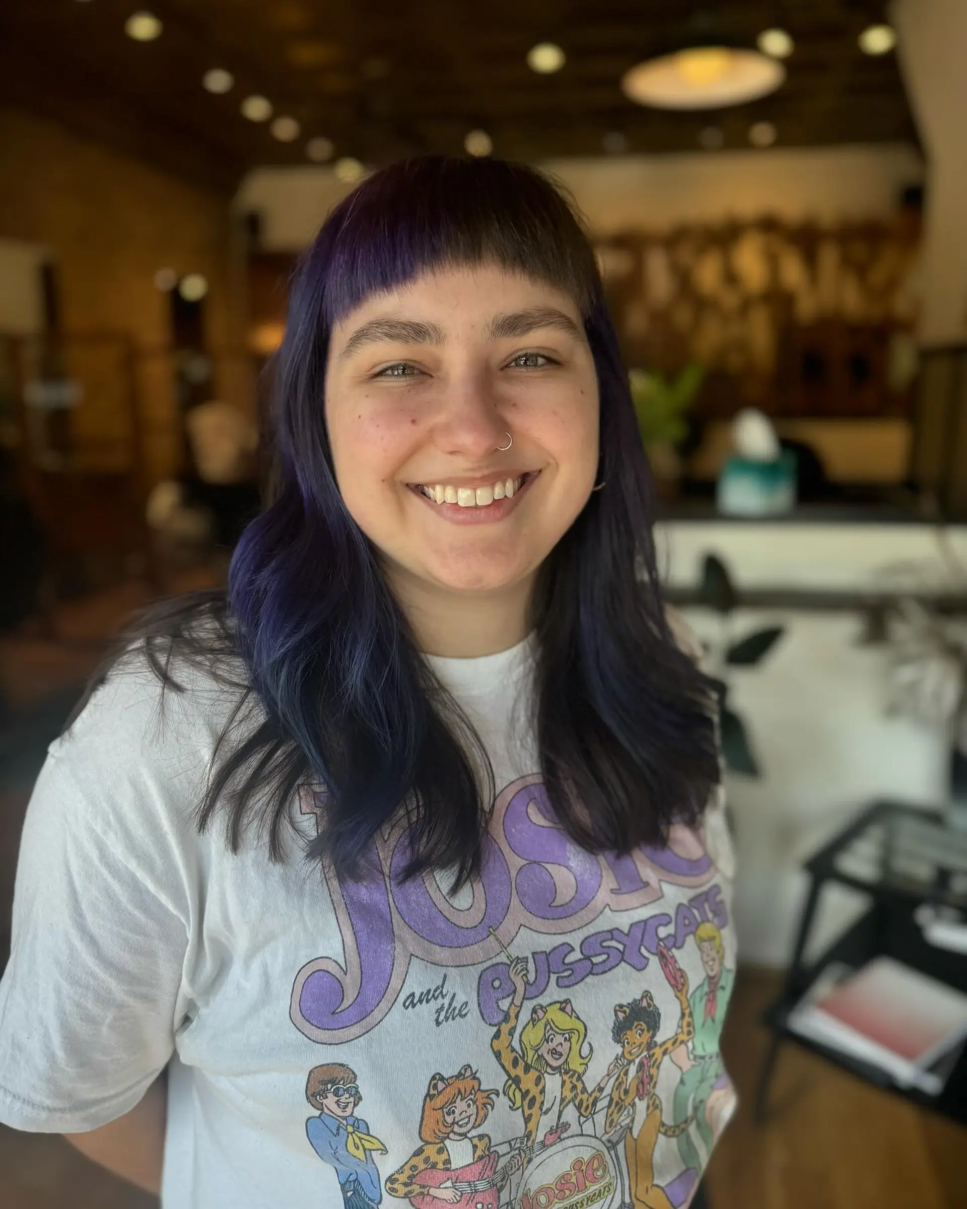 Long, straight hair with short blunt bangs, featuring an indigo and purple color melt. 1