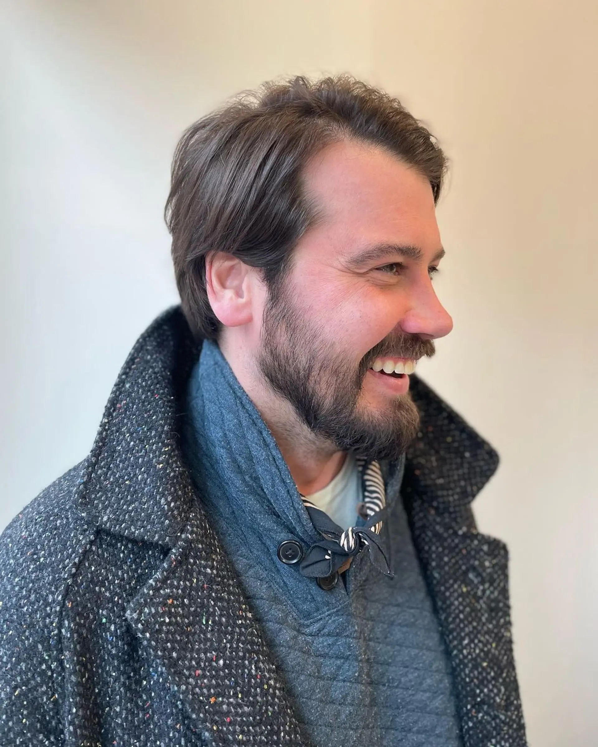 A medium-length, wavy brown hairstyle with a side part, showcasing a natural, laid-back flow and low maintenance charm. 1