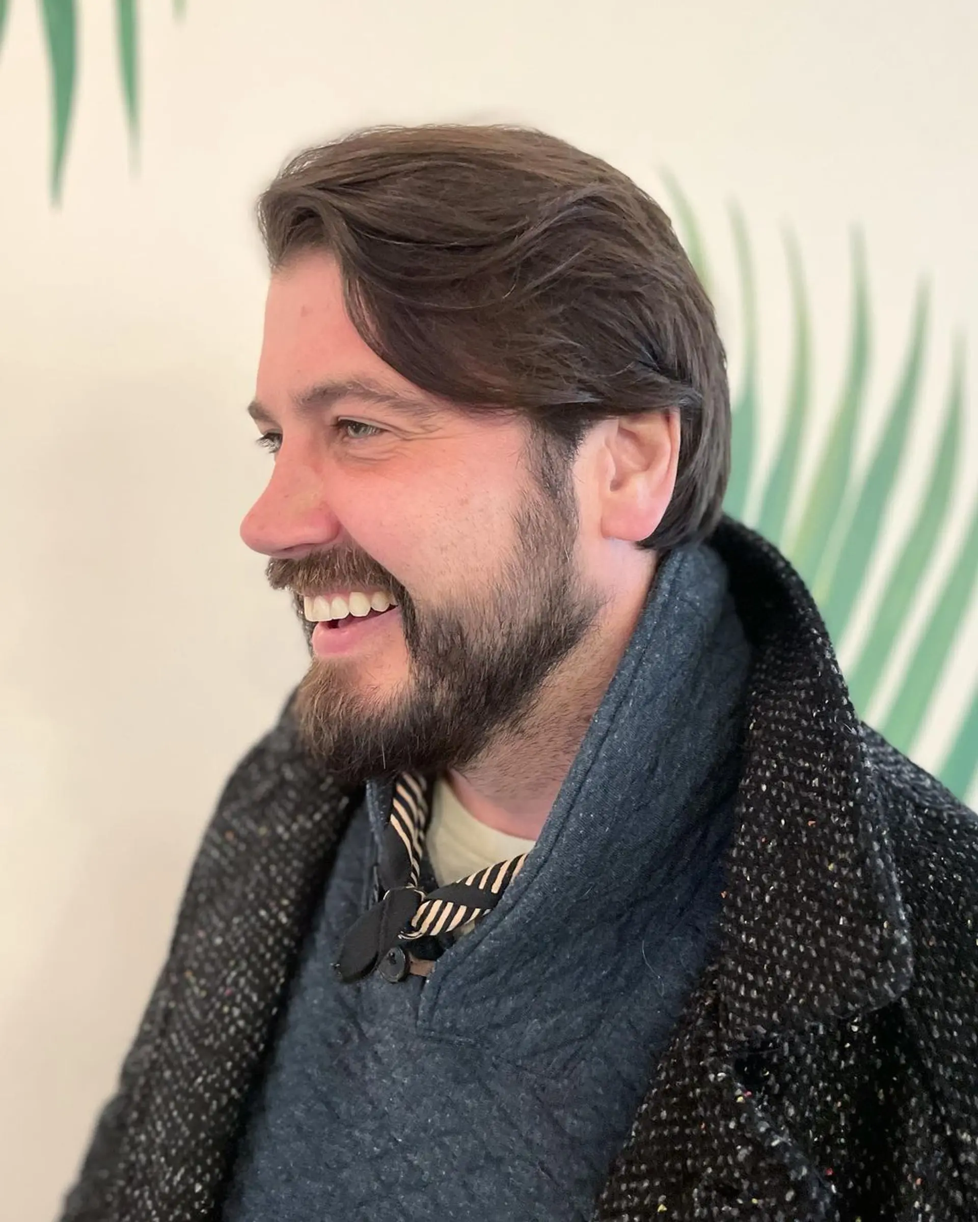 A medium-length, wavy brown hairstyle with a side part, showcasing a natural, laid-back flow and low maintenance charm. 2