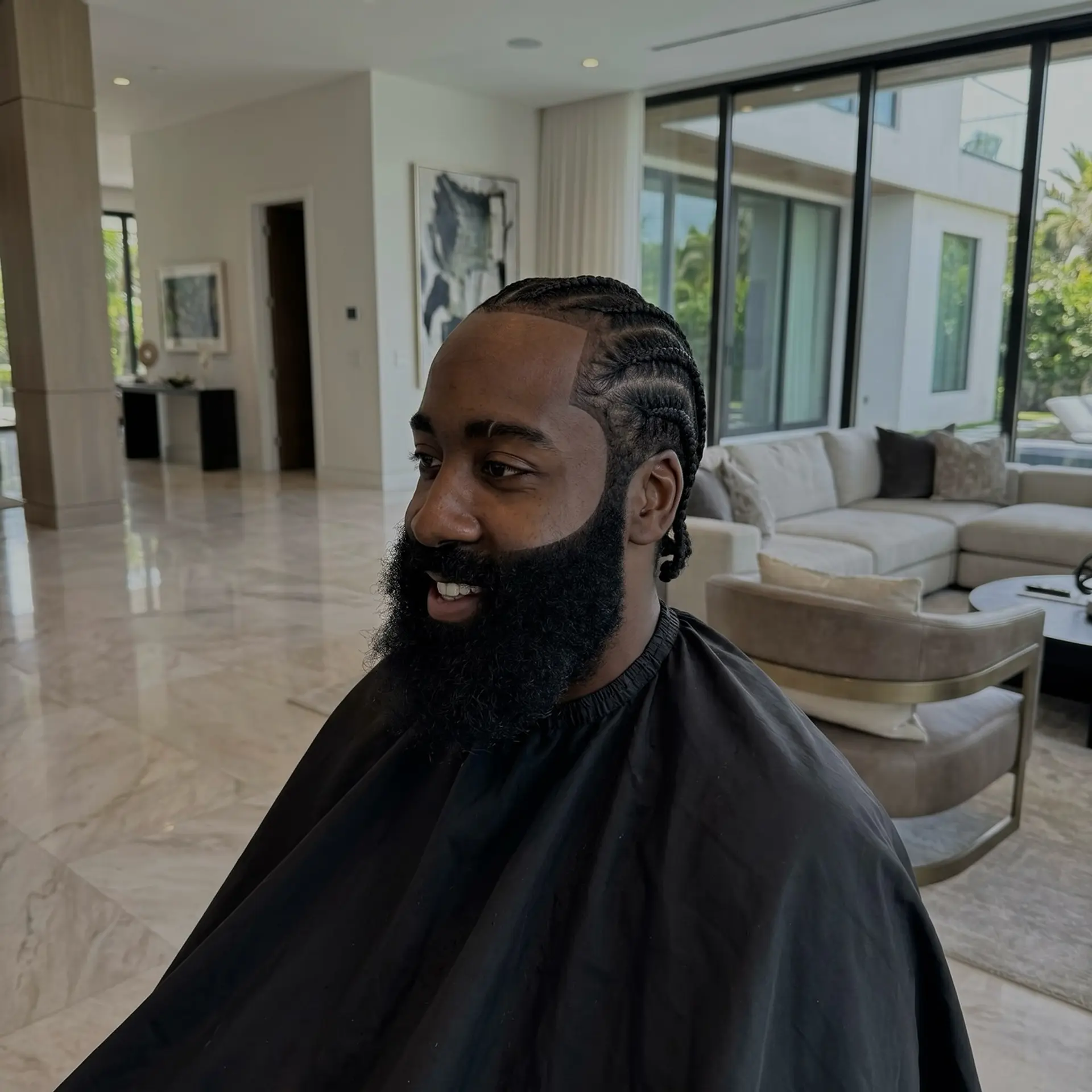 Neat cornrows braided straight back paired with an ultra-sharp edge up and a full, sculpted beard. 1