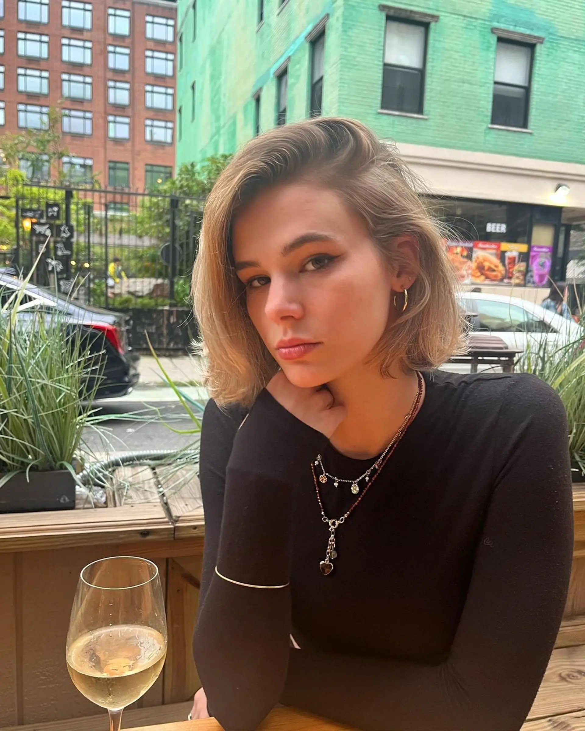 A medium-length, light blonde bob with a natural wave and side part, providing an urban-chic, effortless look. 1