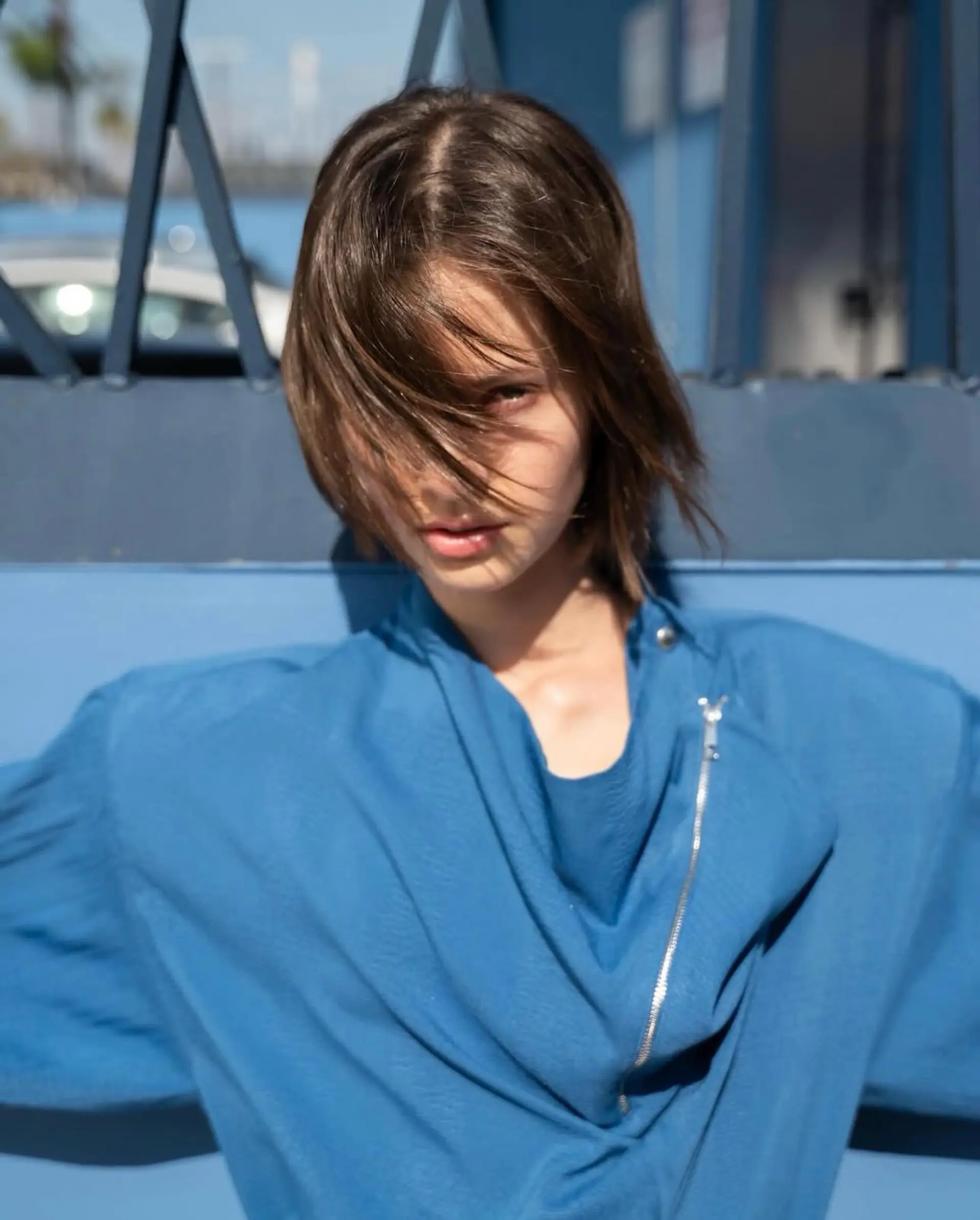 A textured short brown bob with effortless piecey fringe swept across the face. 1