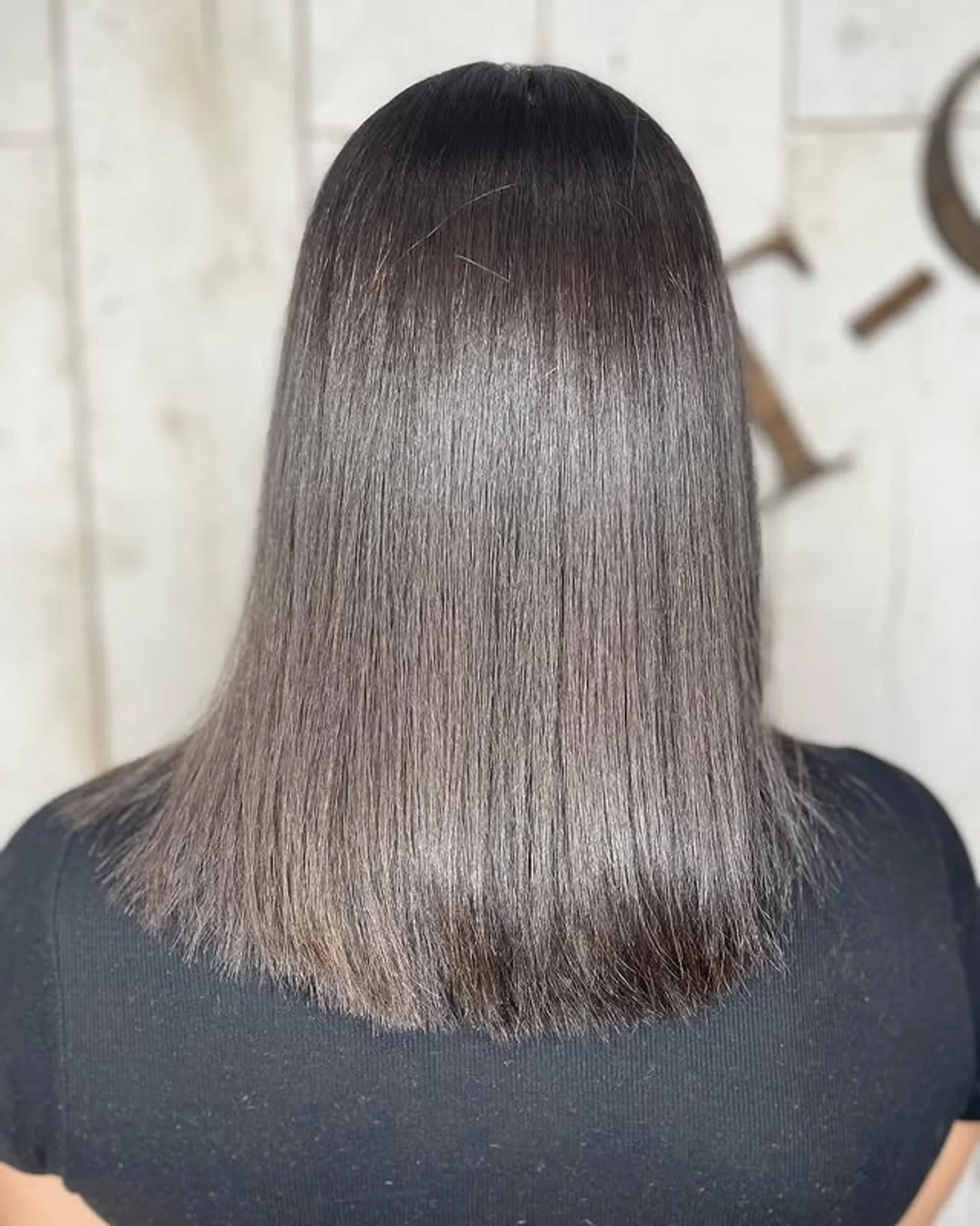 Woman with long, wavy dark brown hair featuring bouncy, face-framing 'Ghost Layers' for voluminous look - Preview 1