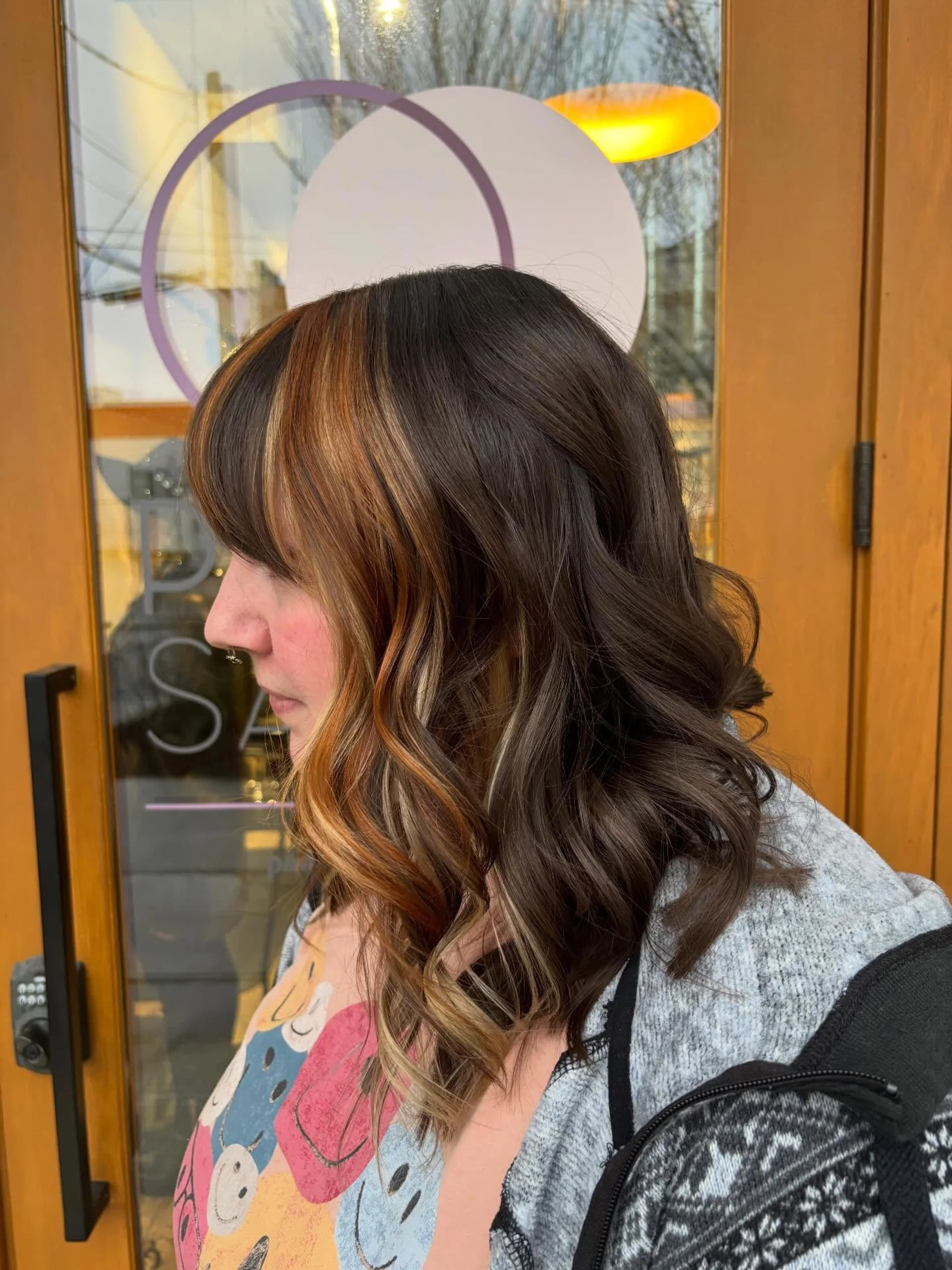 Dark wavy hair with woven copper highlights and face-framing layers - Preview 1