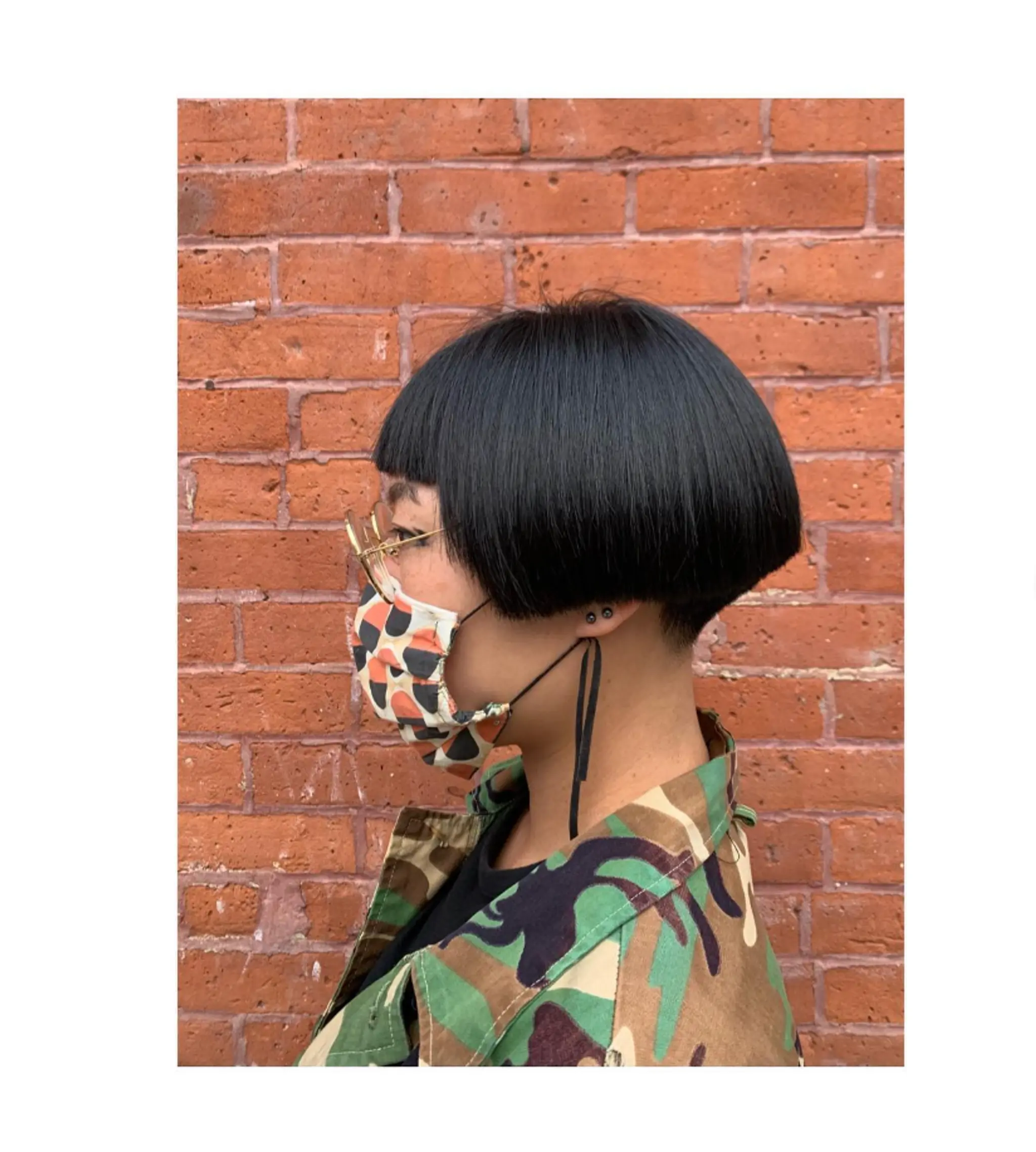A short, blunt bob with a bold, straight-across fringe.