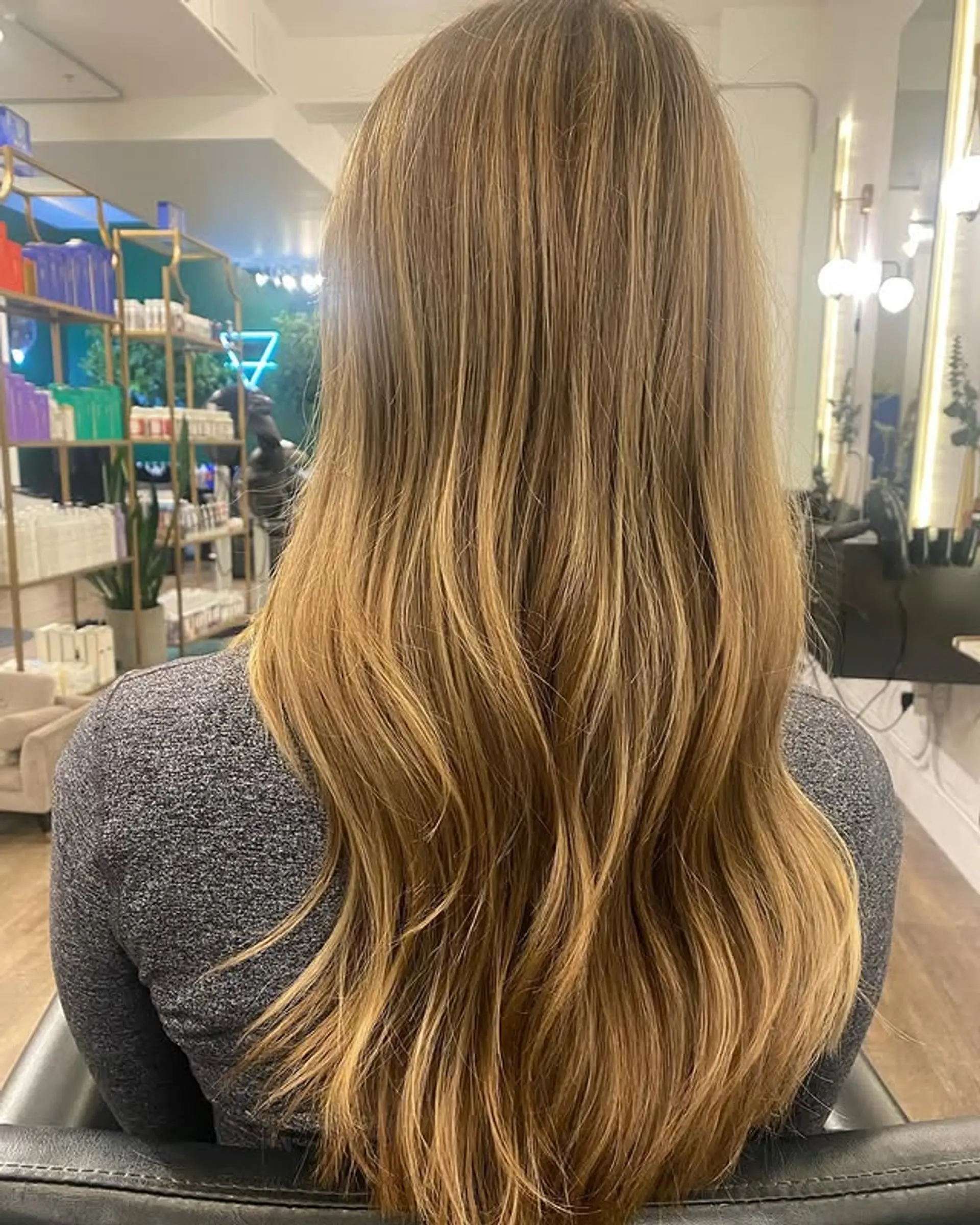Long layered hair with a bronde balayage, offering a soft and dimensional look. 1