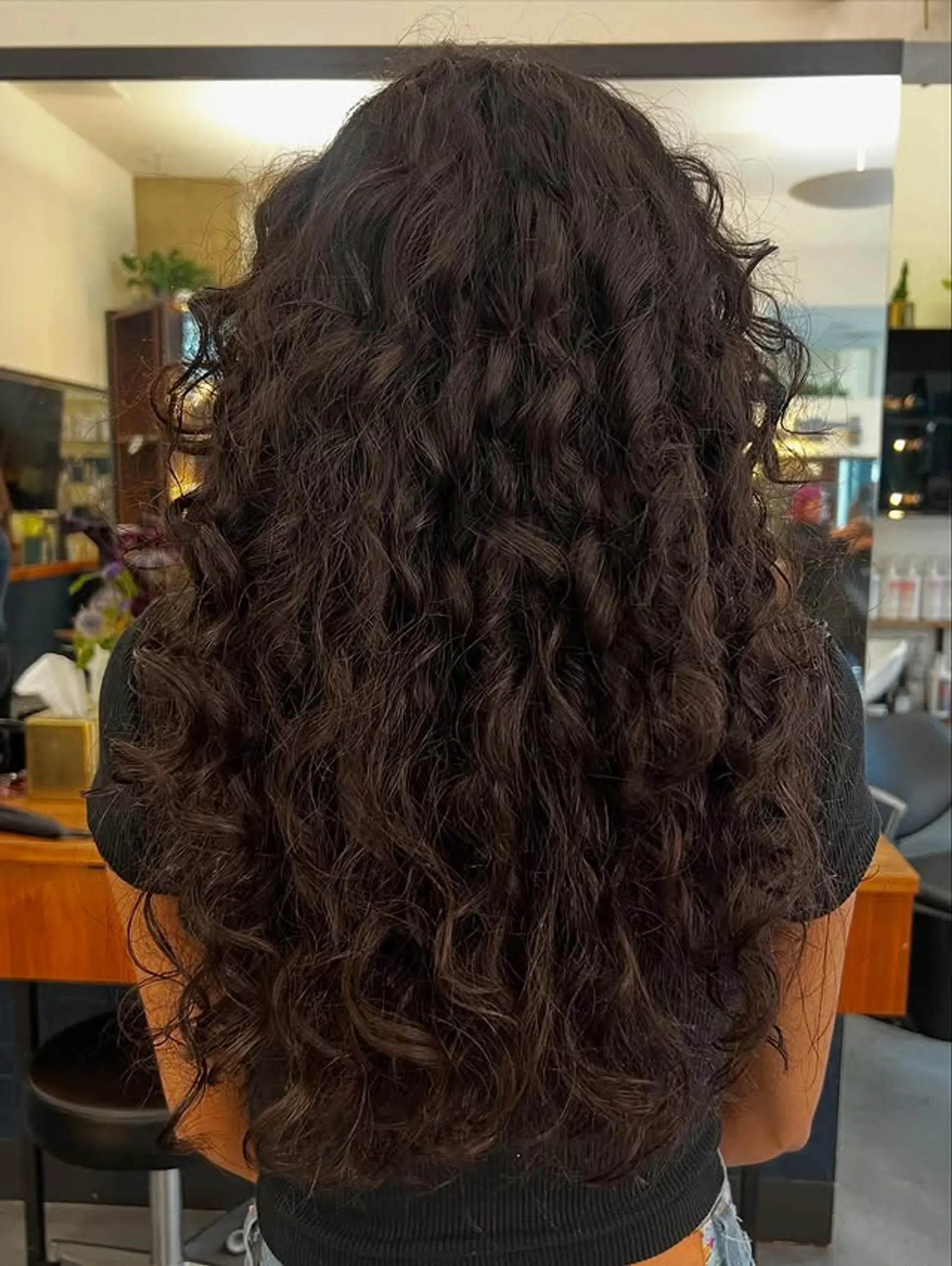 Long, layered curly hairstyle. 1