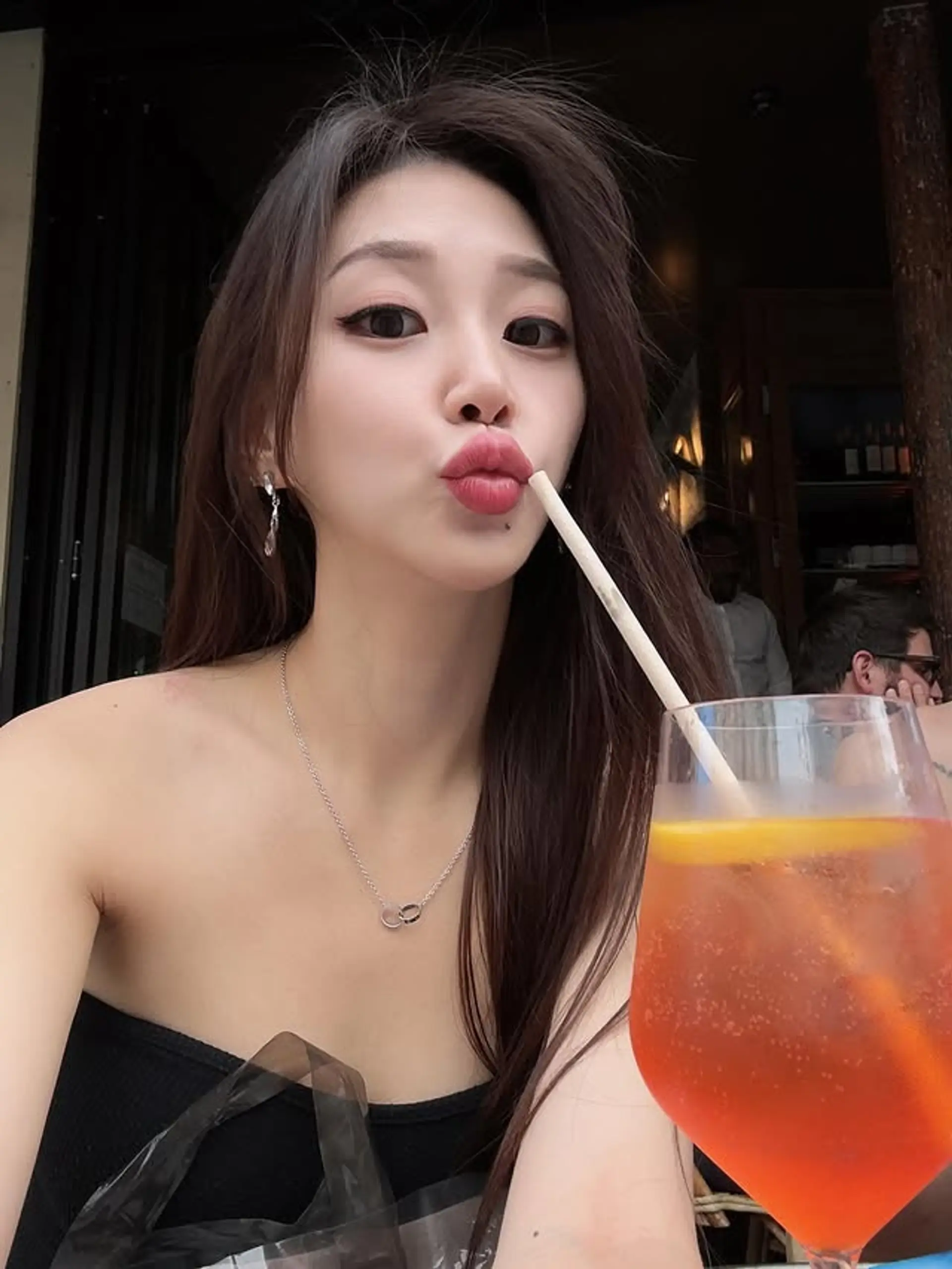 Long brunette hairstyle with subtle layers for added movement. 1