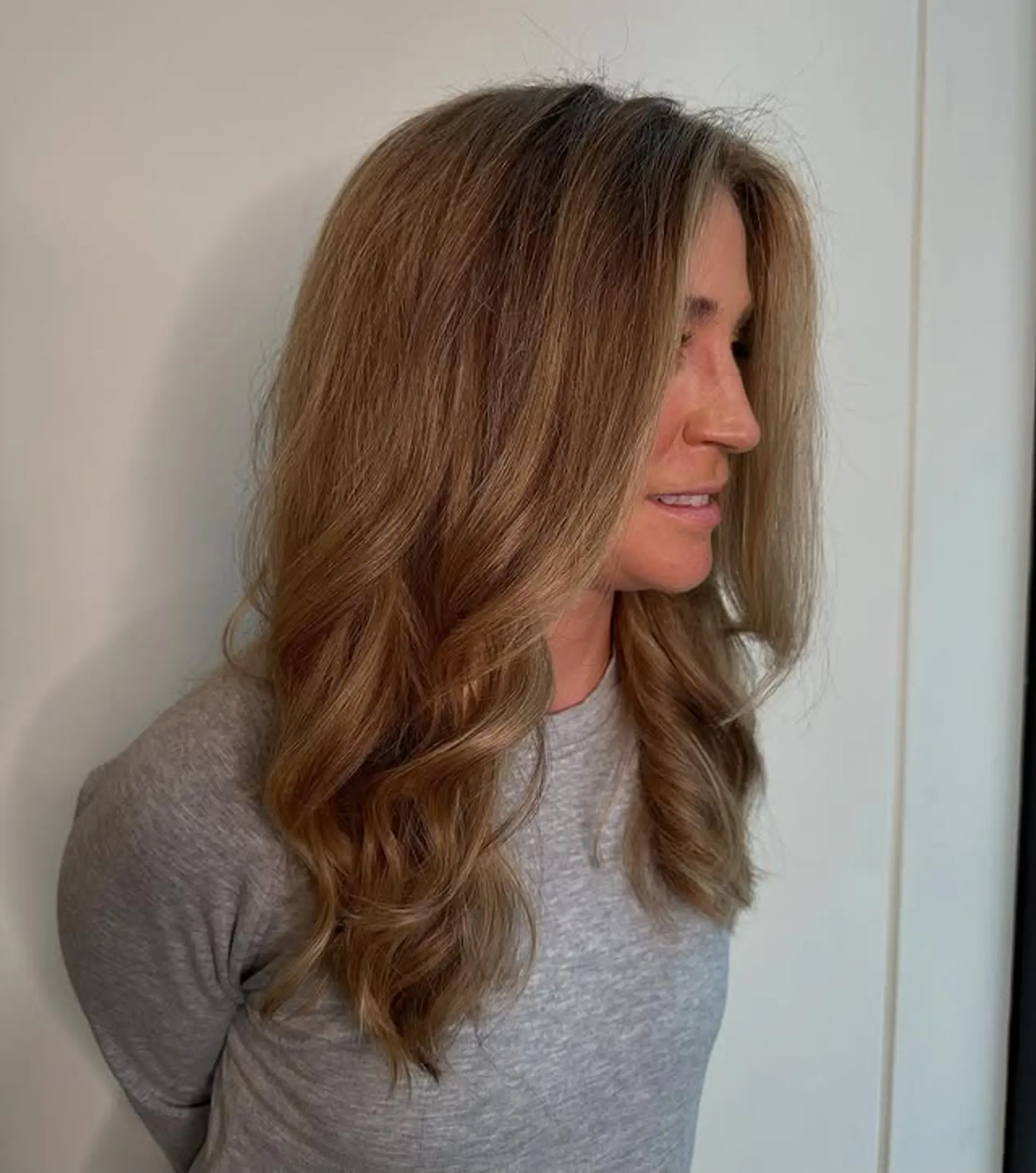 Layered medium length hair with soft, golden waves. 1
