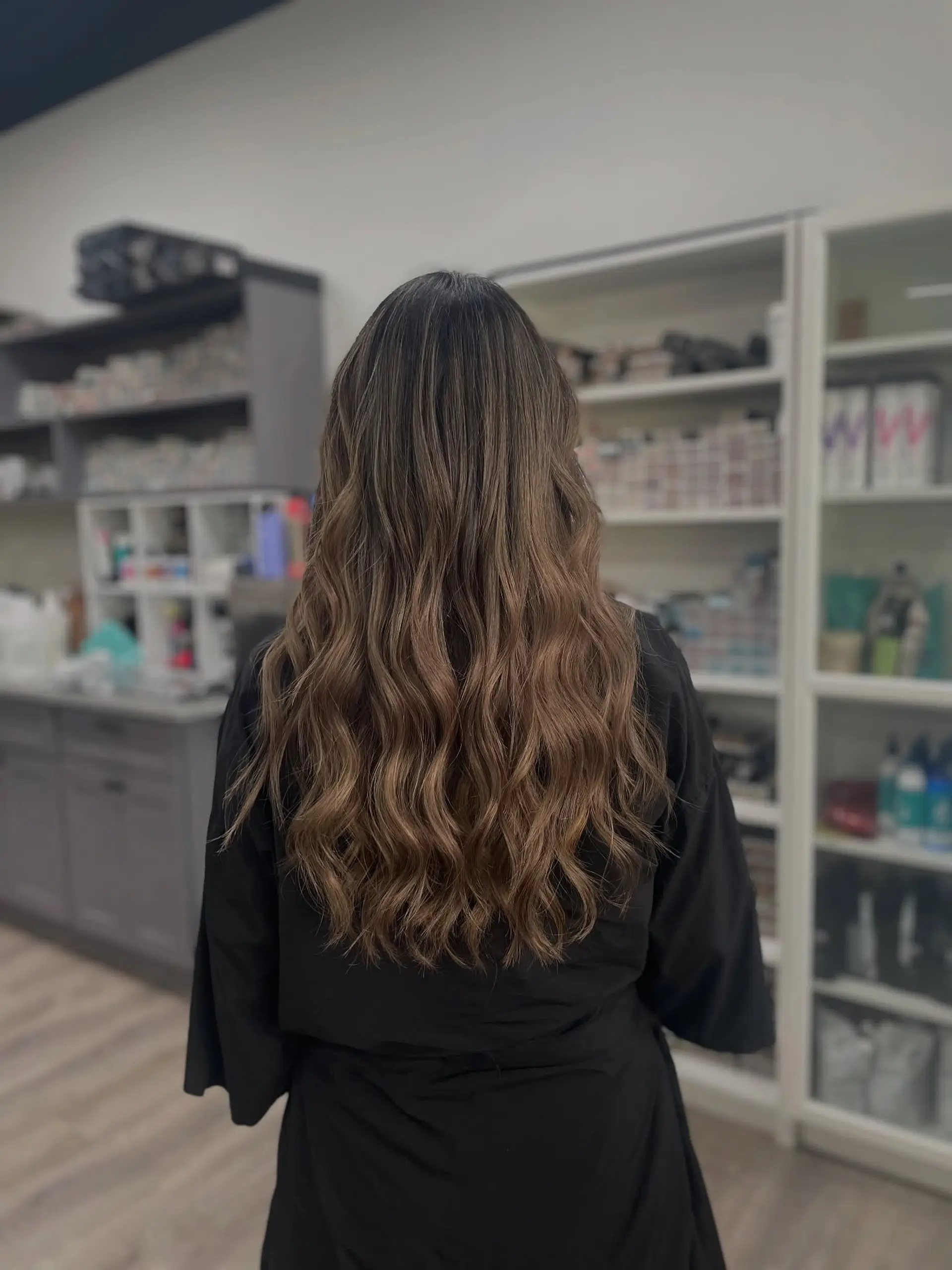 Long and wavy bronde balayage with subtle layers. 1