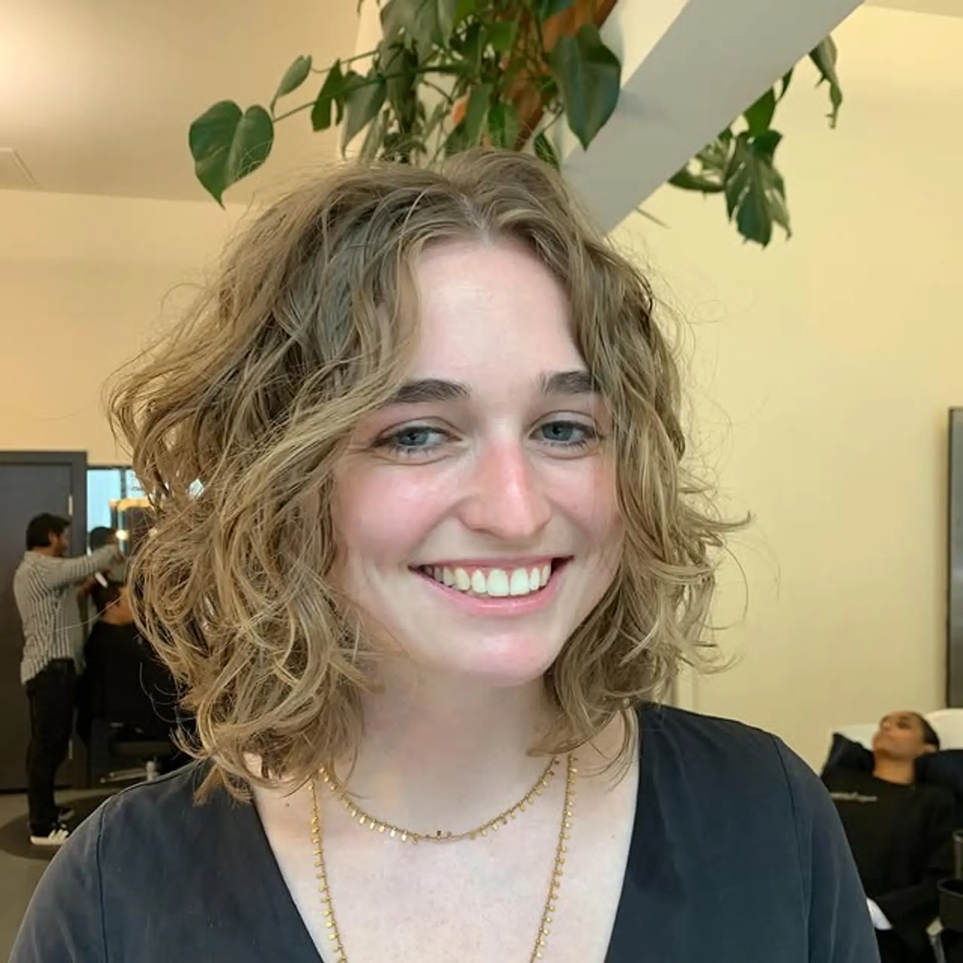 A mid-length shaggy bob with loose curls and textured layers. 1