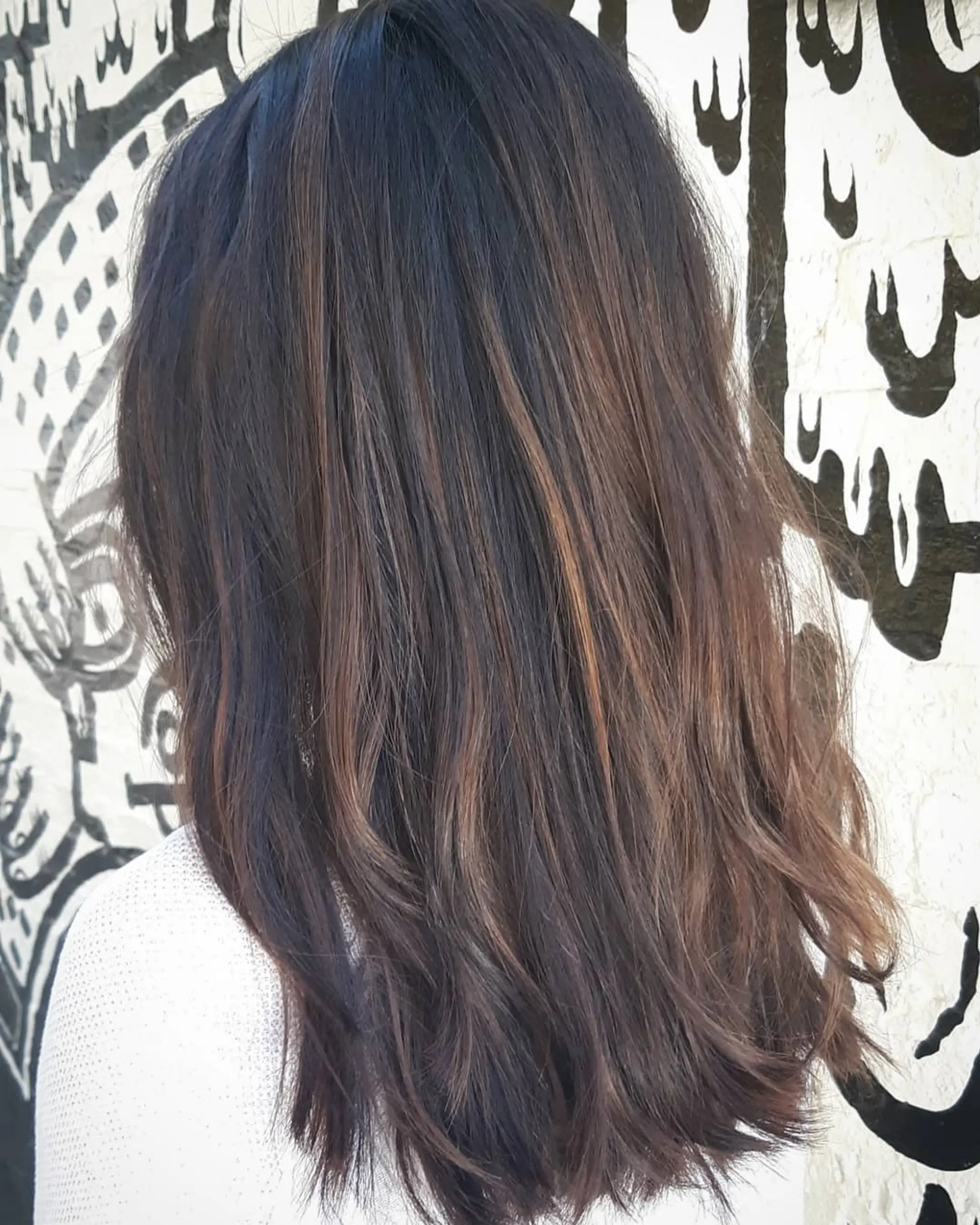 Medium length wavy hair with a chocolate brown balayage. 2
