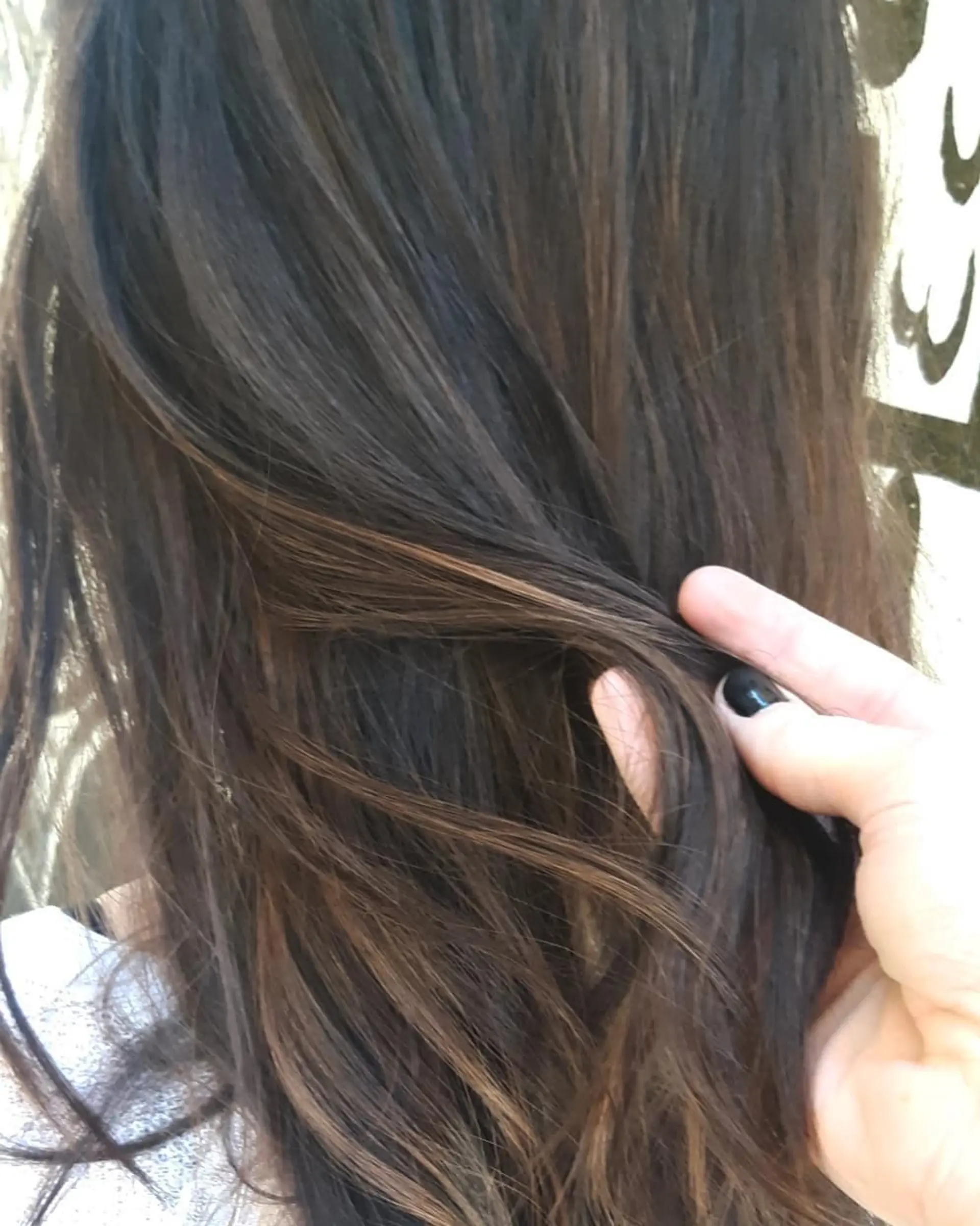 Medium length wavy hair with a chocolate brown balayage. 3