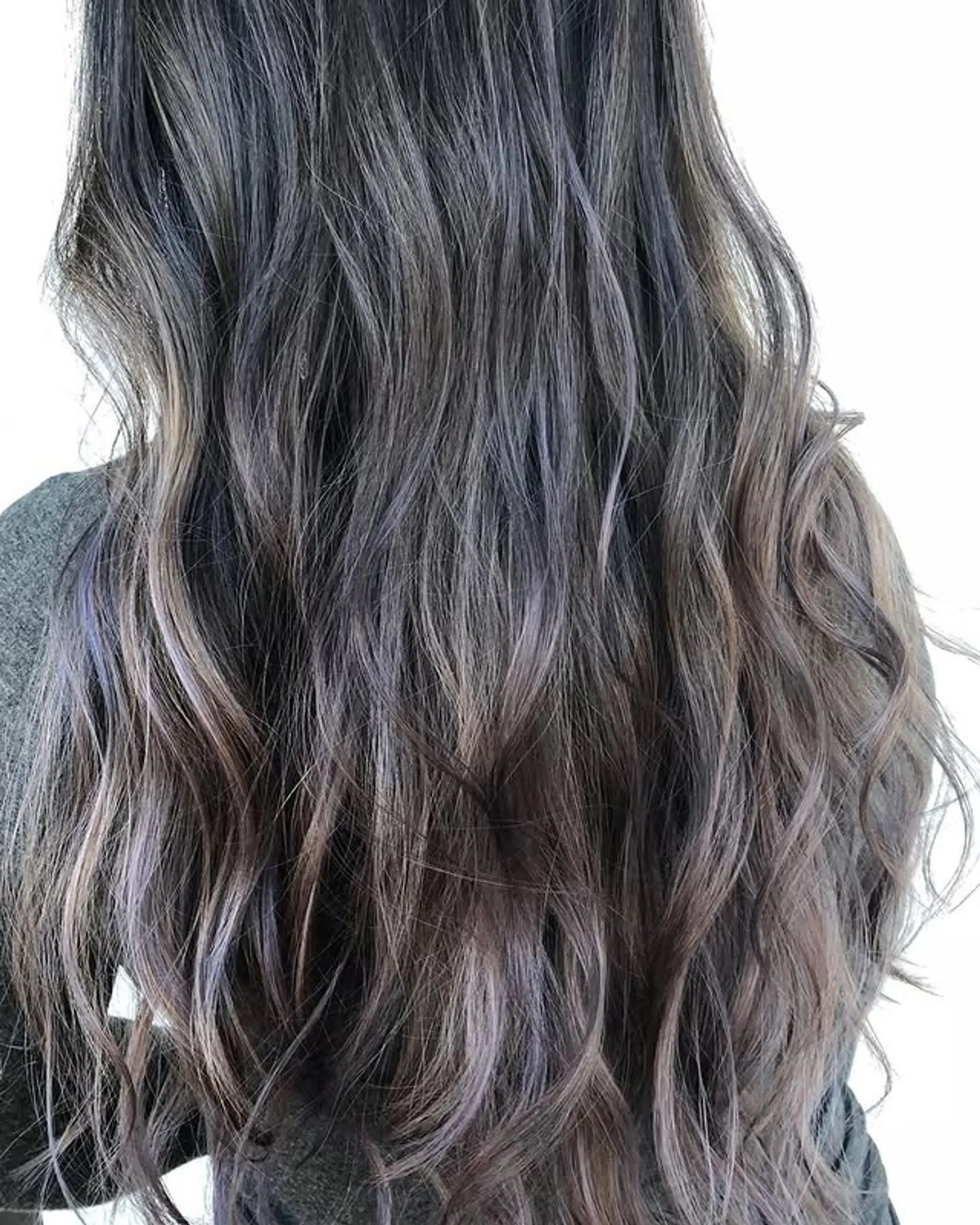 Long wavy hair with a smoky lavender balayage. 1
