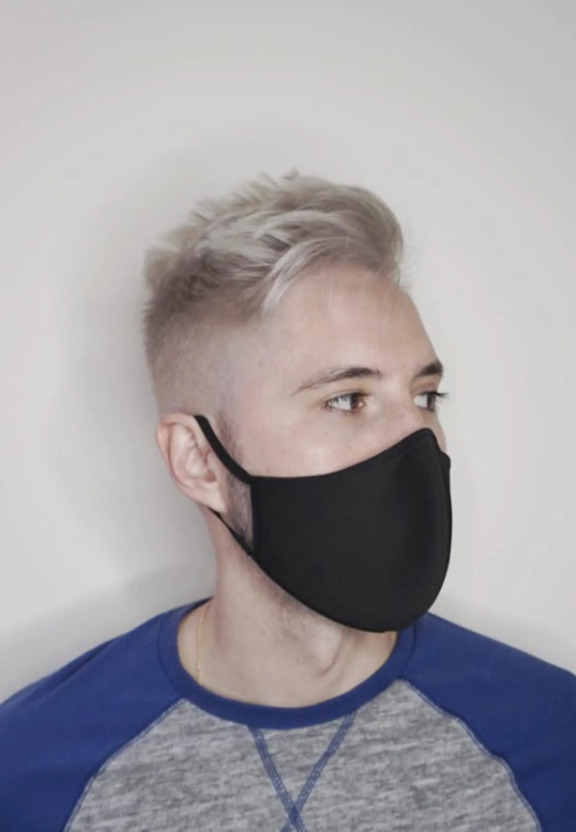 A short buzz cut with a faded style, featuring a textured top. 1