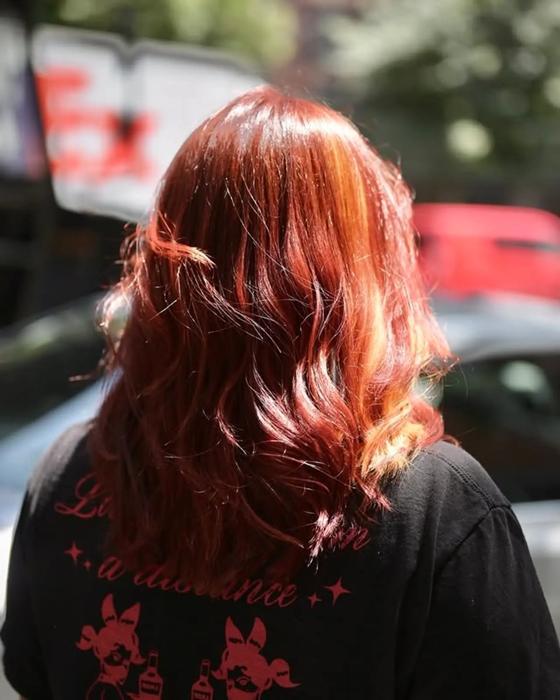 Medium-length wavy hair with a red and copper balayage. 1