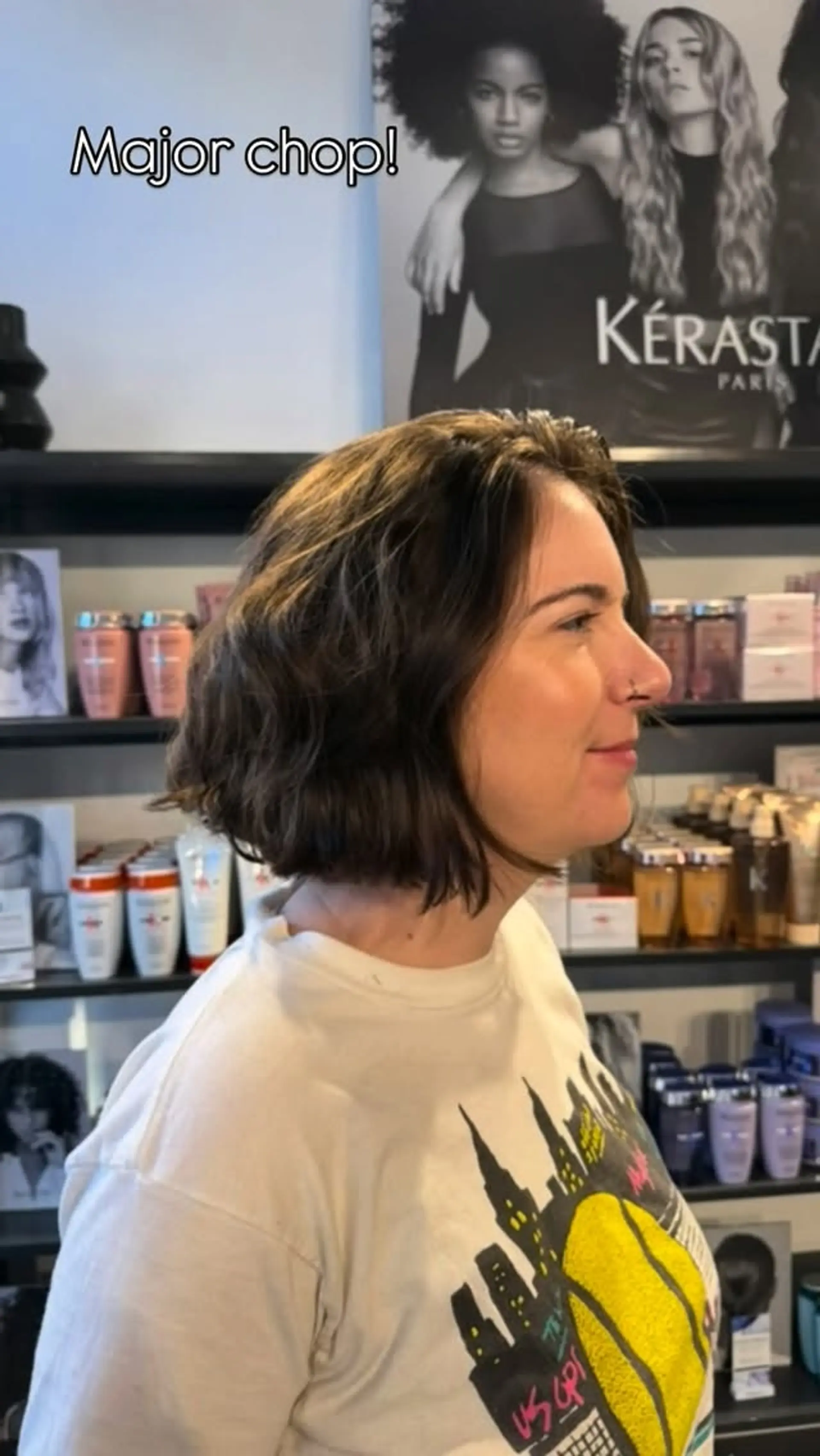 A chin-length textured bob haircut styled with soft, casual waves. 1