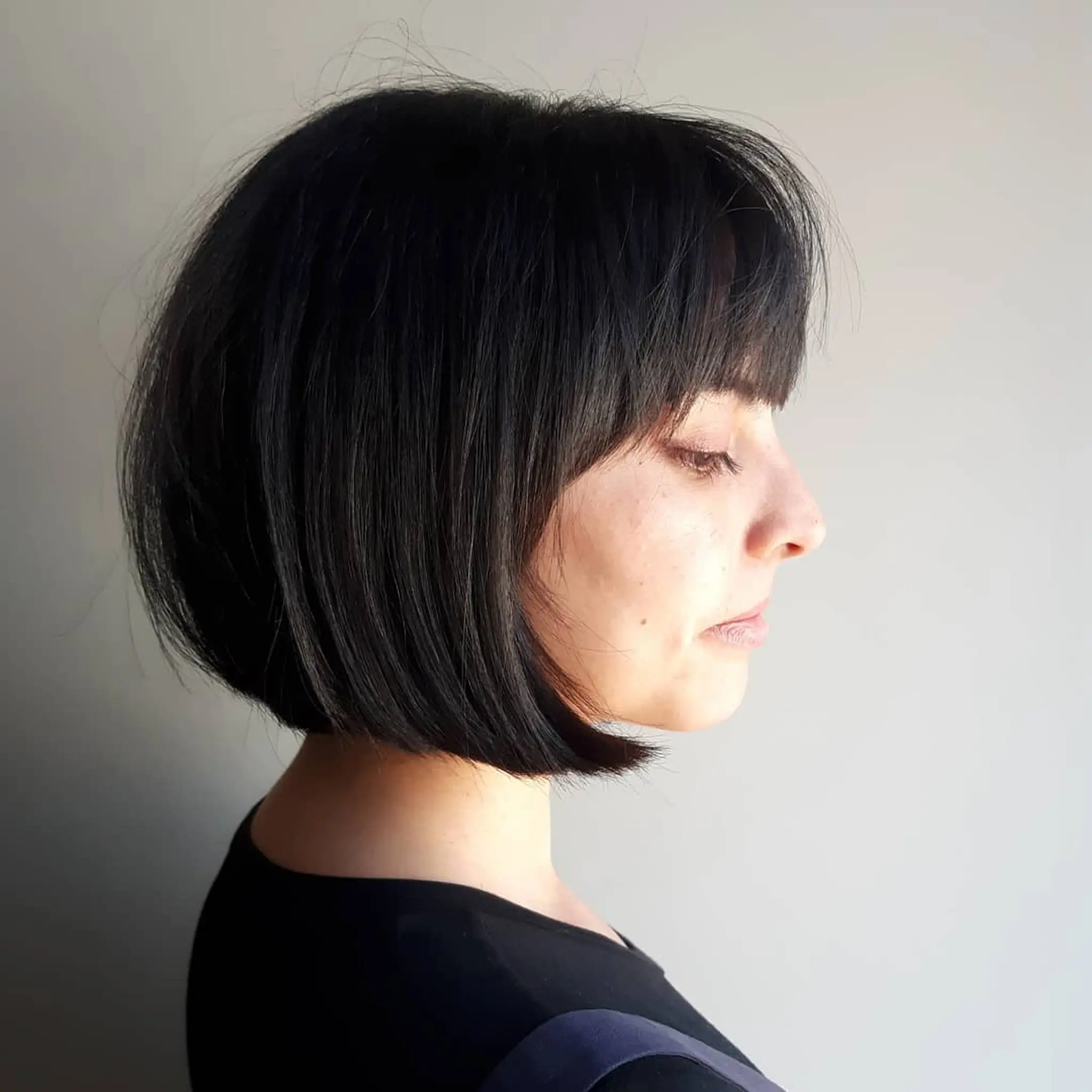 A modern French bob with blunt bangs. 1