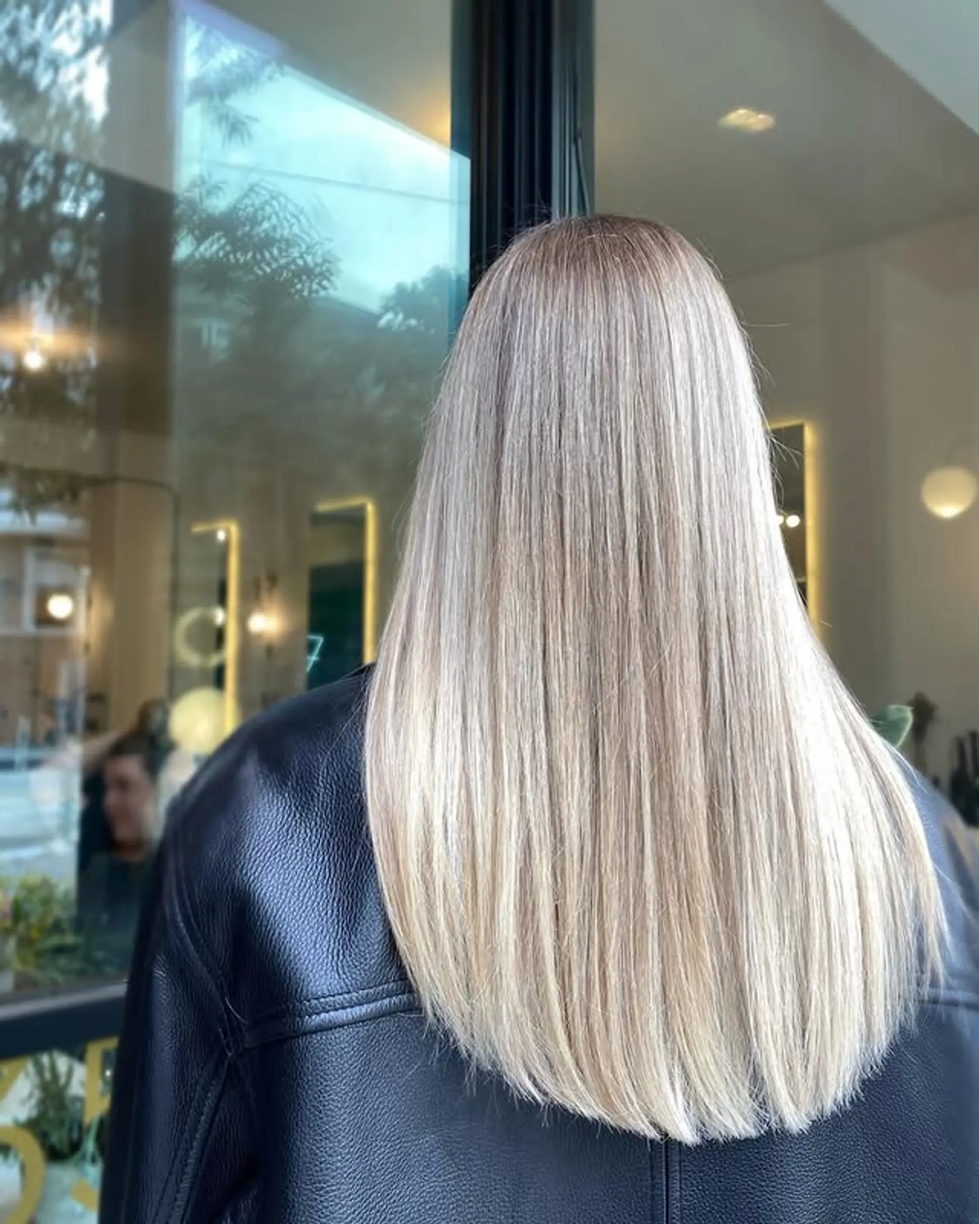 Long, straight icy blonde hair with subtle layers. 1