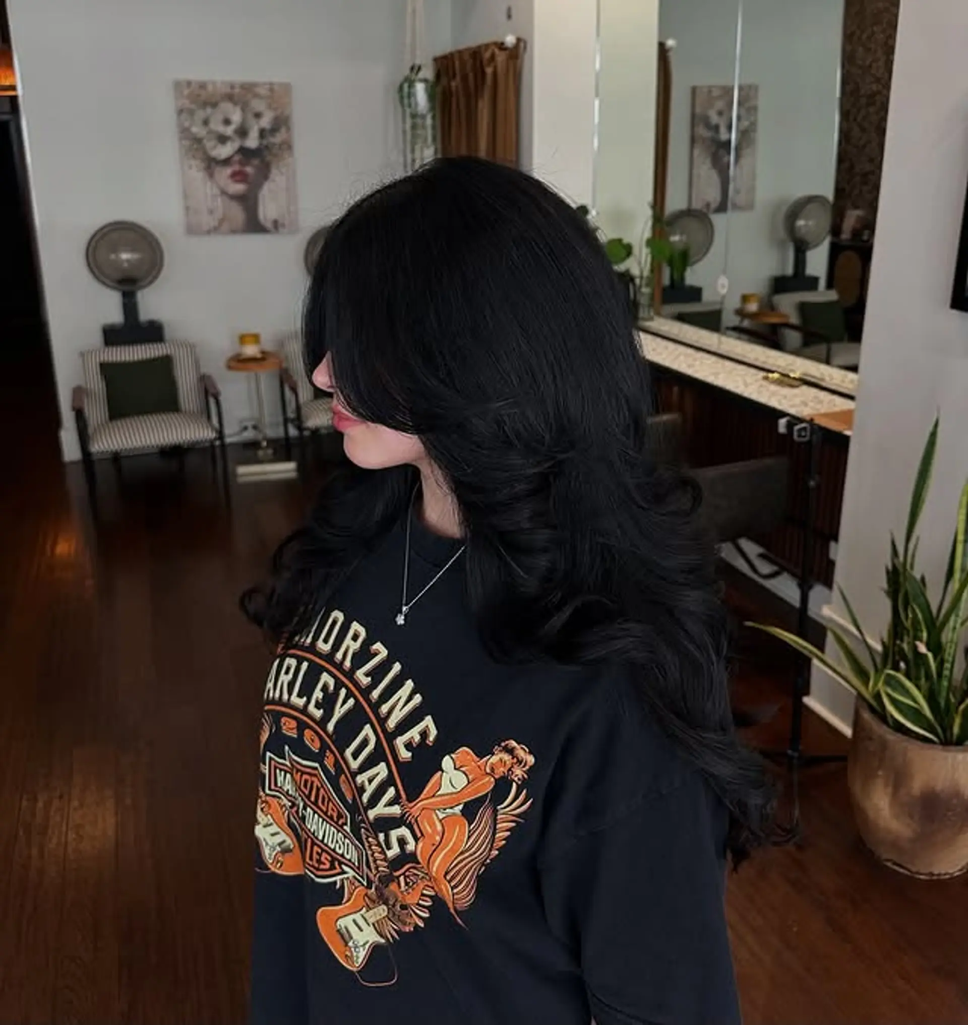 A long layered wolf cut with flipped ends and curtain bangs. 1