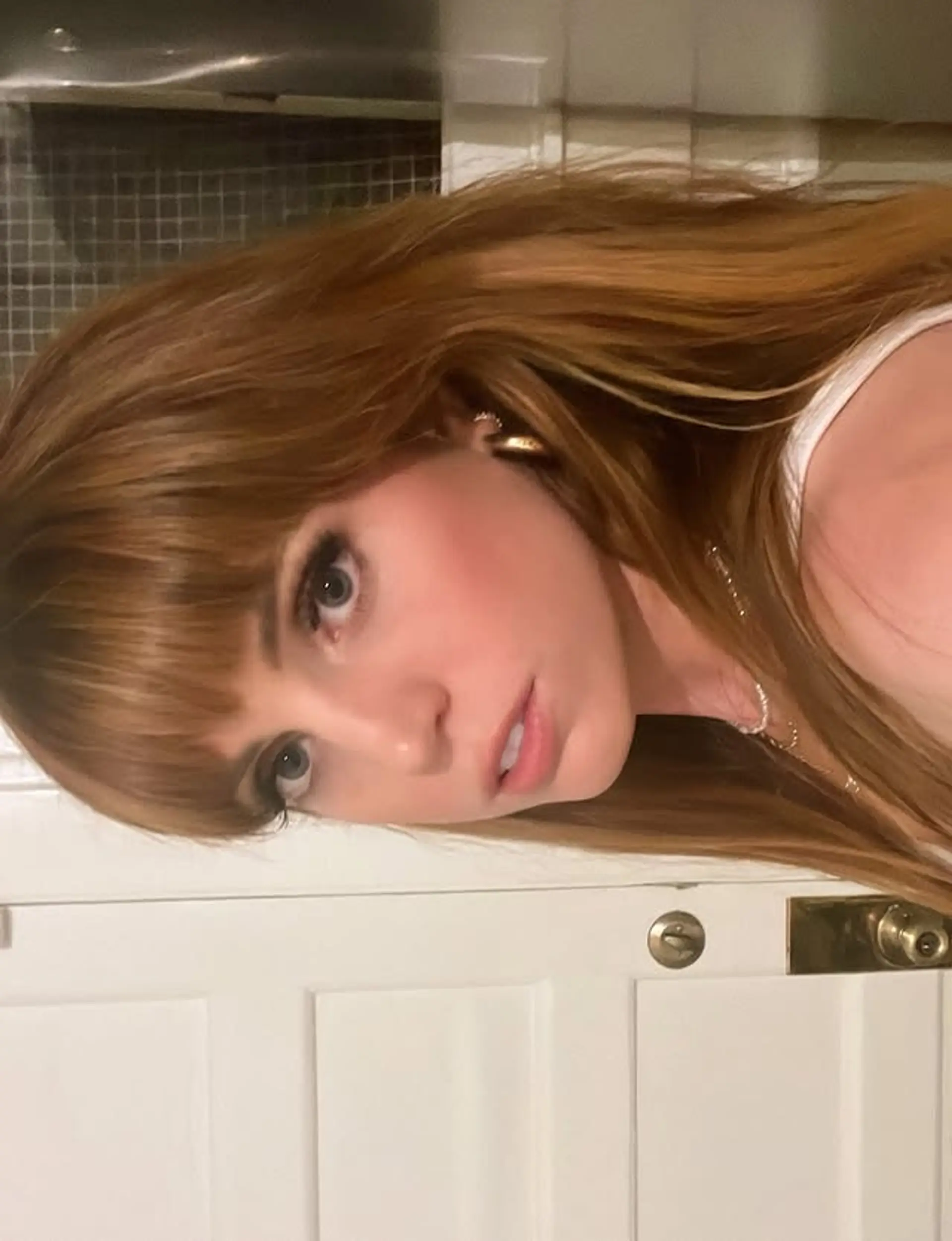 Medium length straight hair with Bardot bangs and face framing layers. 1