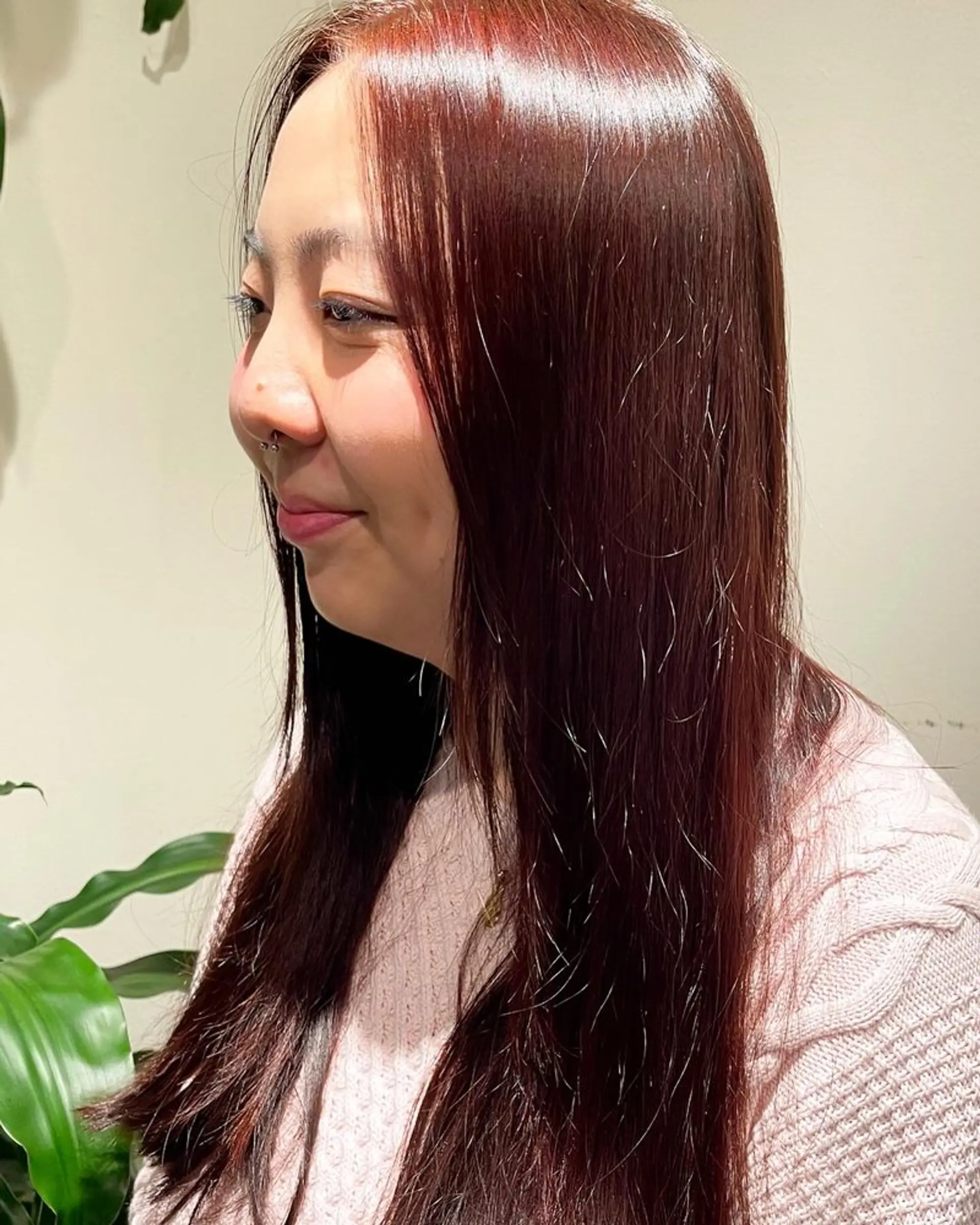 Long, layered hair with a sleek, straight style. 1