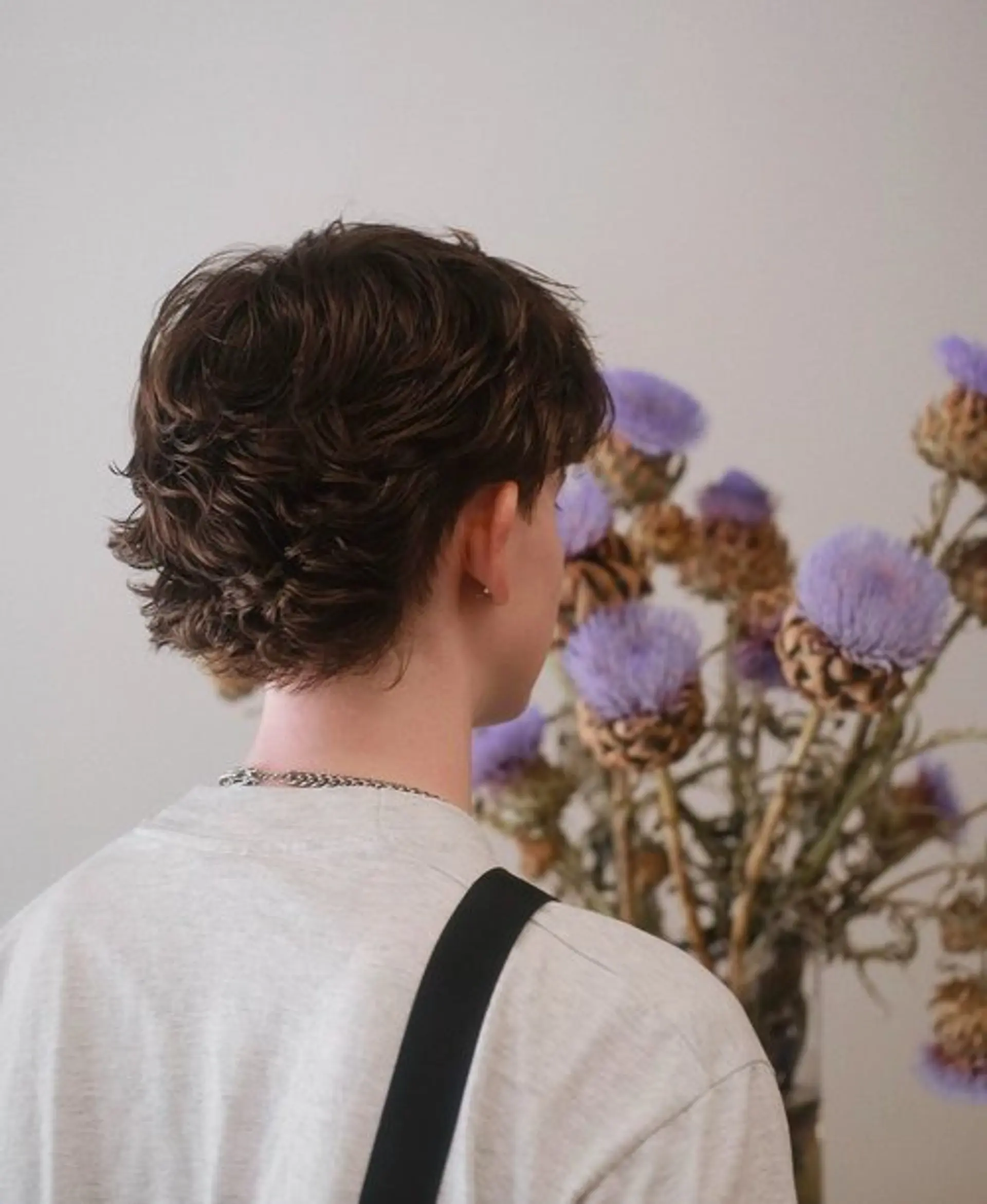 A textured and shaggy mullet with layered waves. 1