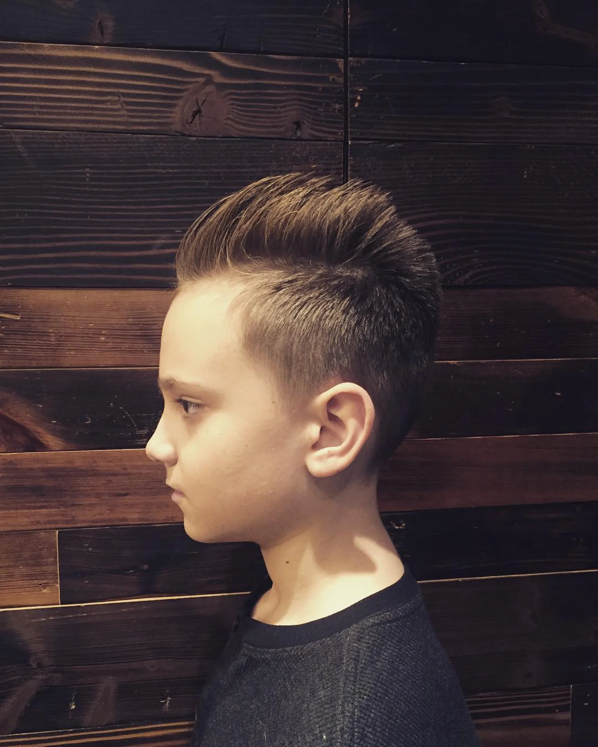 A stylish man sporting a textured pompadour, emphasizing volume and natural hold. - Preview 2