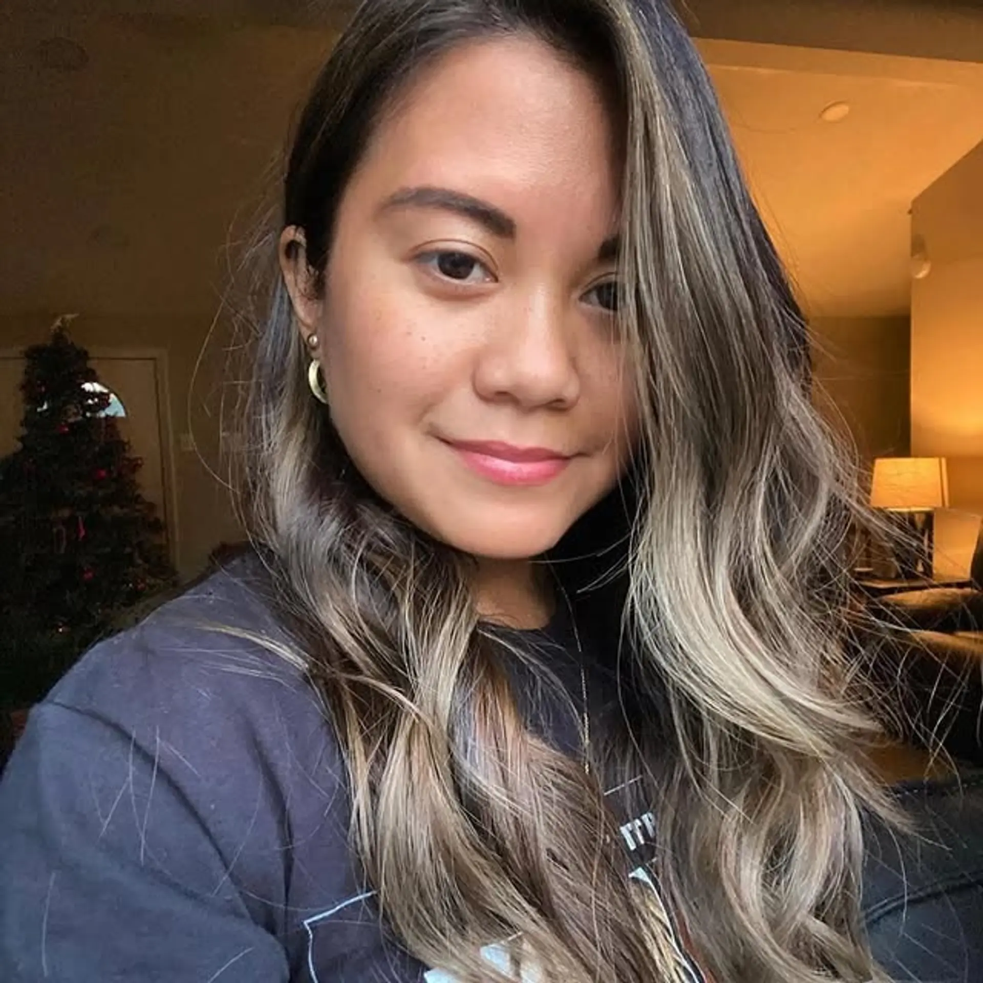 Long wavy hair with a seamless balayage that fades into ash blonde tips. 1