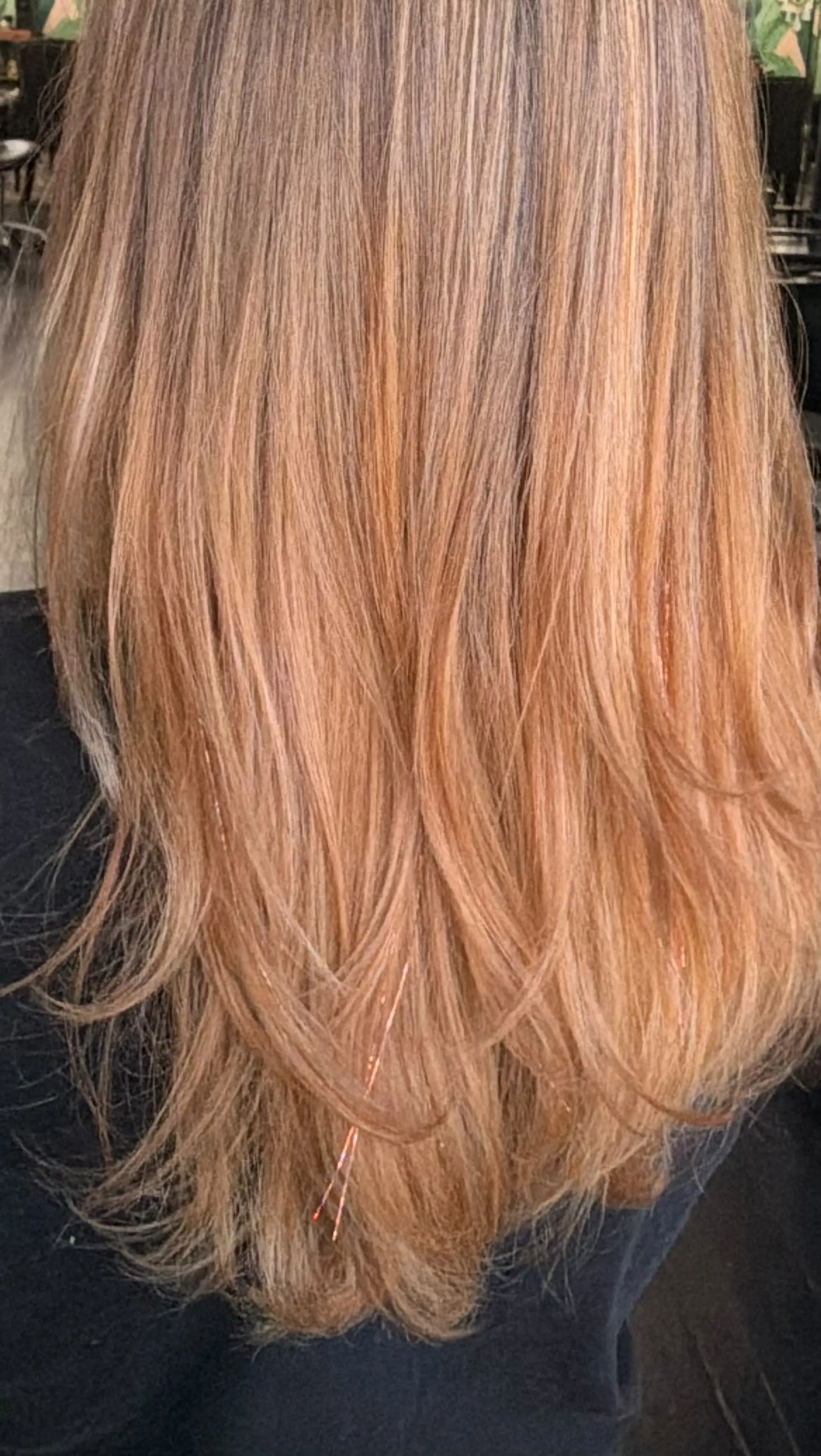 Long layered warm blonde hair featuring dimensional highlights and shimmering hair tinsel strands. 1