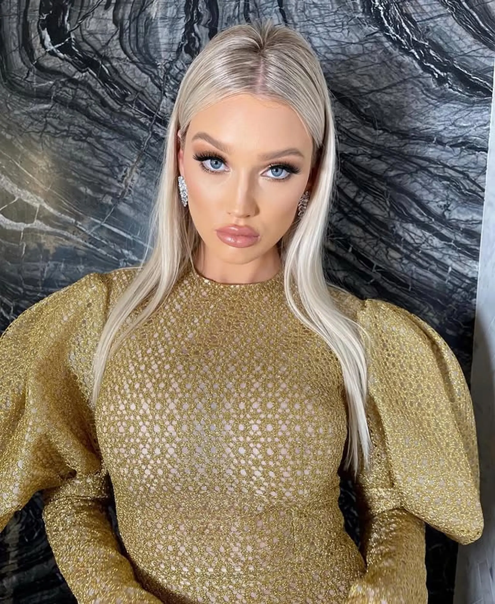 Long, straight, and sleek platinum blonde hair with a center part. 1