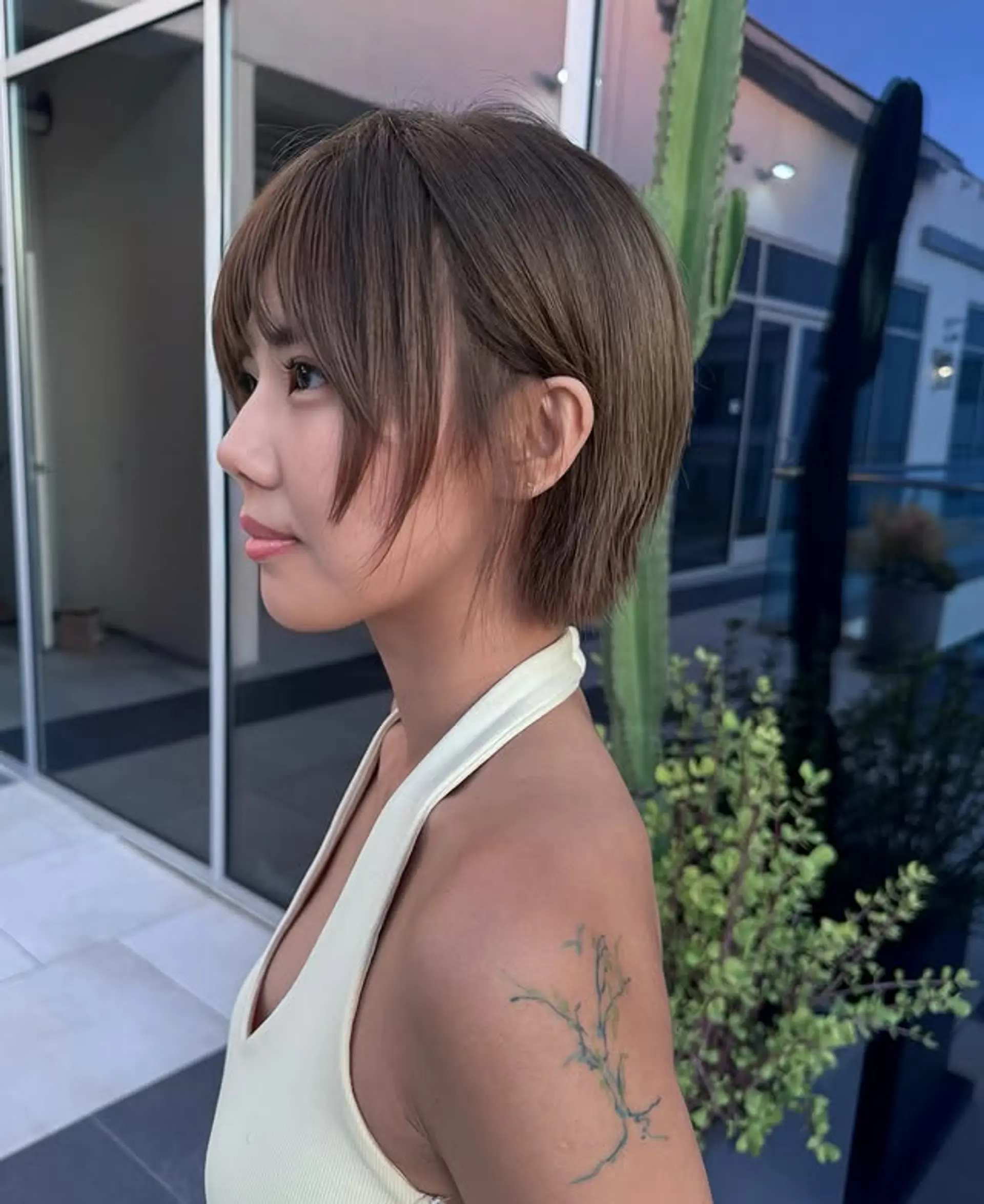 A chic blunt bob with stylish bangs. 1